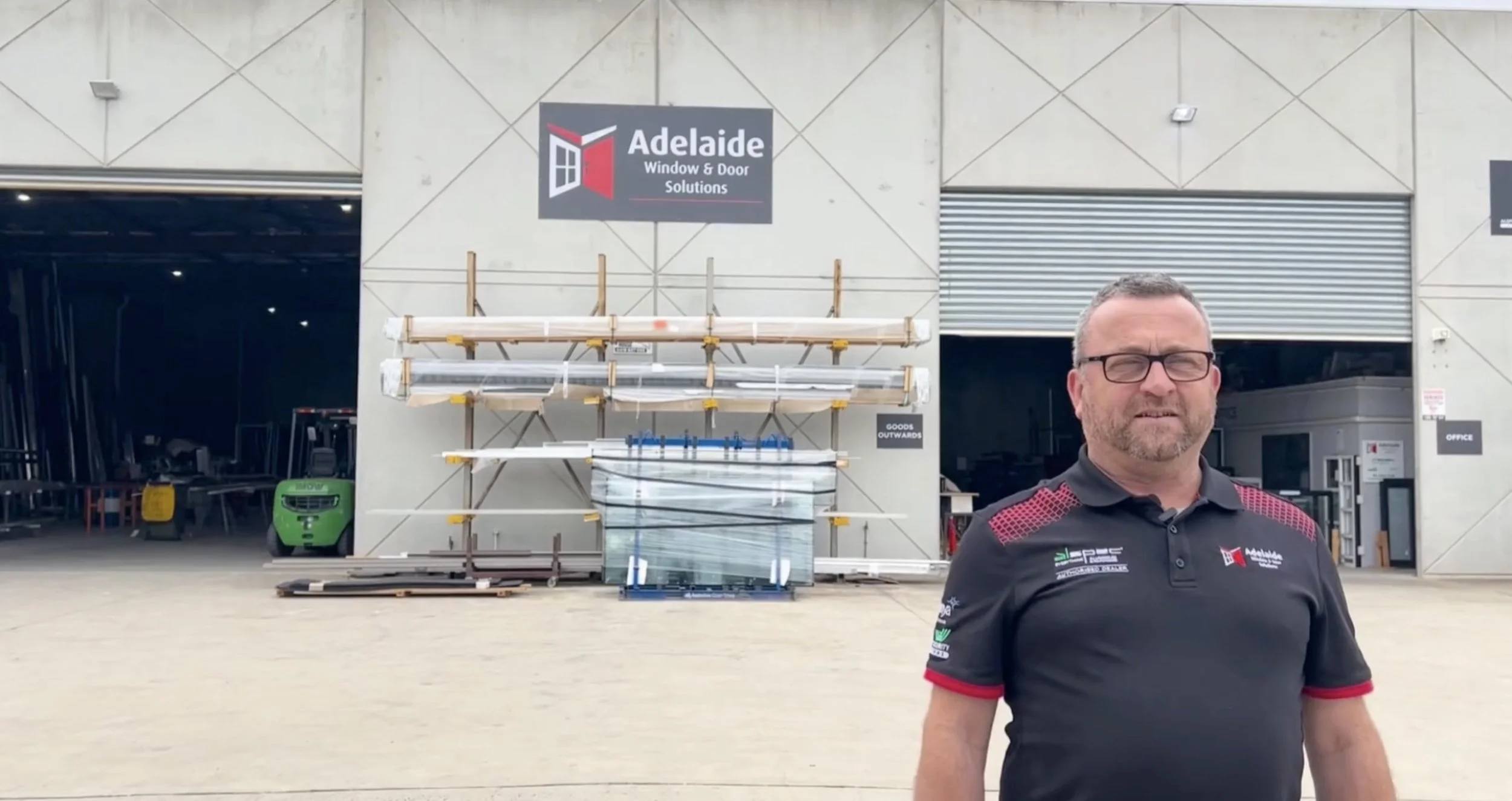 Adelaide Window and Door Solutions representative at their warehouse, a corporate sponsor supporting the Hoa Mai solar project