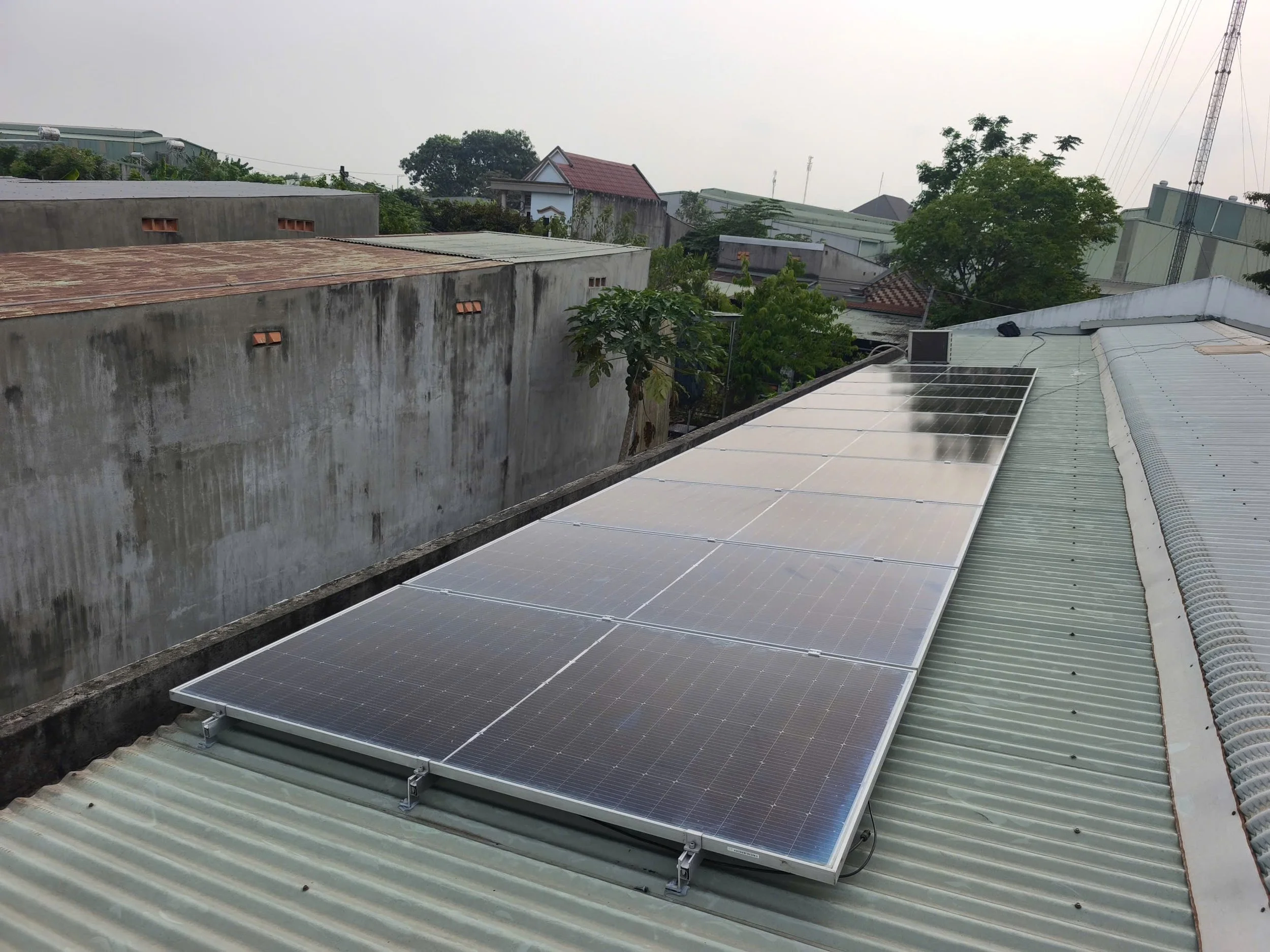 Showing a row of panels on the roof of the orphanage following the installation