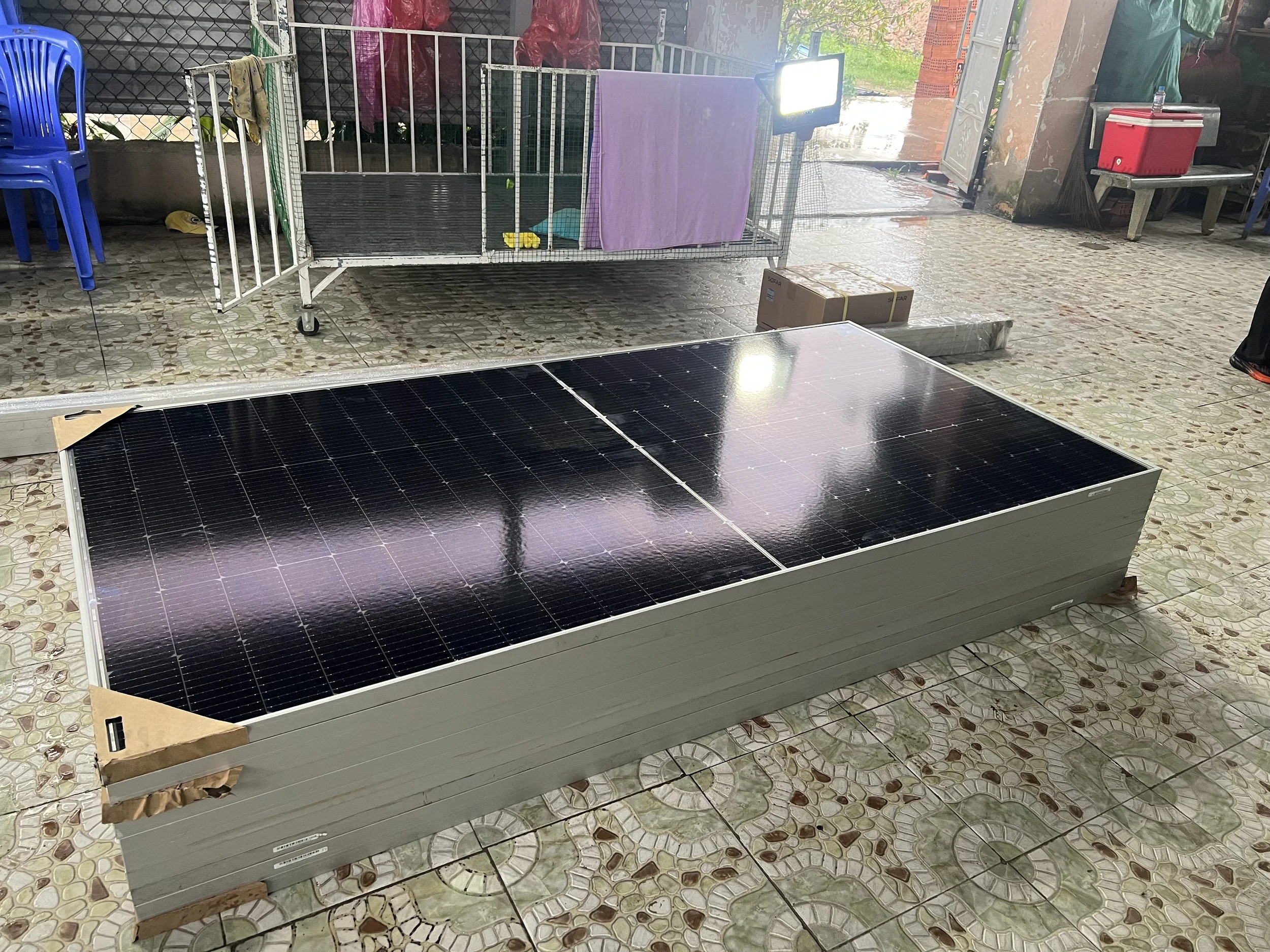 Solar panels stacked and ready for installation at an orphanage in Vietnam