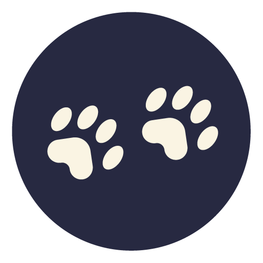 Icon of two cream-colored animal paw prints on a dark blue circular background.