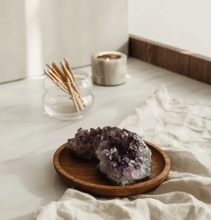 Calm and grounded desk space at The TMJ Chiro with crystals and herbal remedies