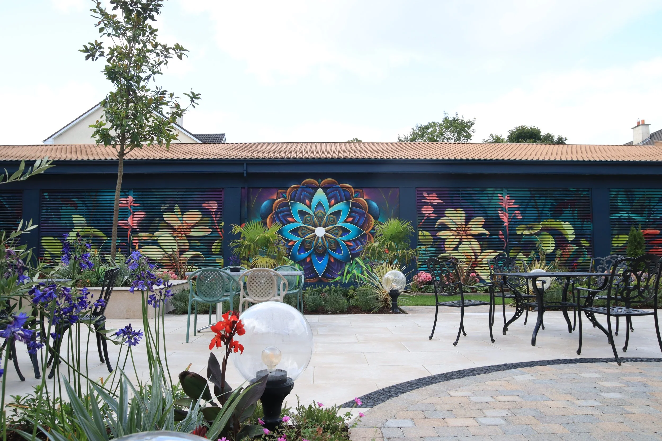 hotel outdoor garden space art mural