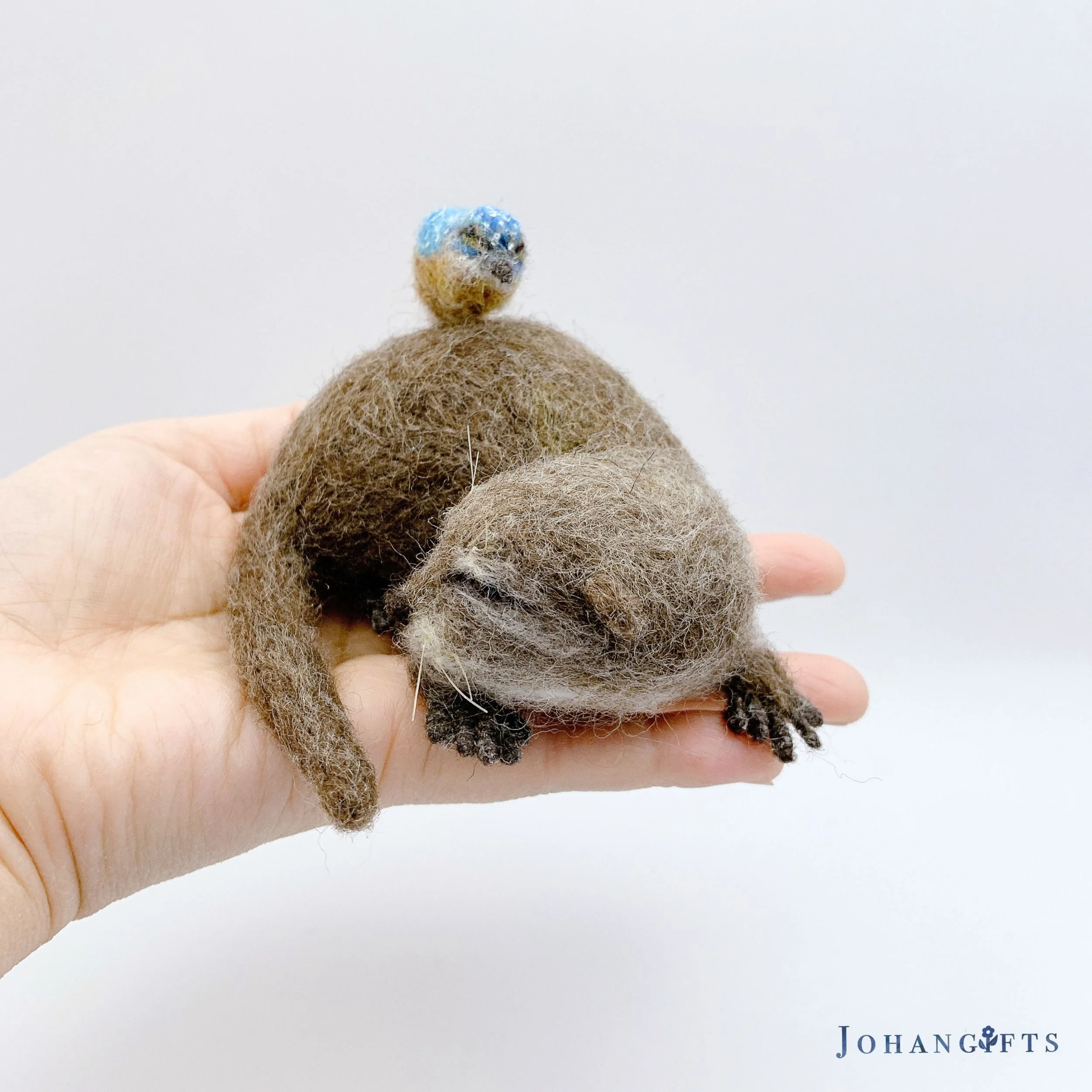 handmade-river-otter-figurine-with-bird-wildlife-decor.jpg