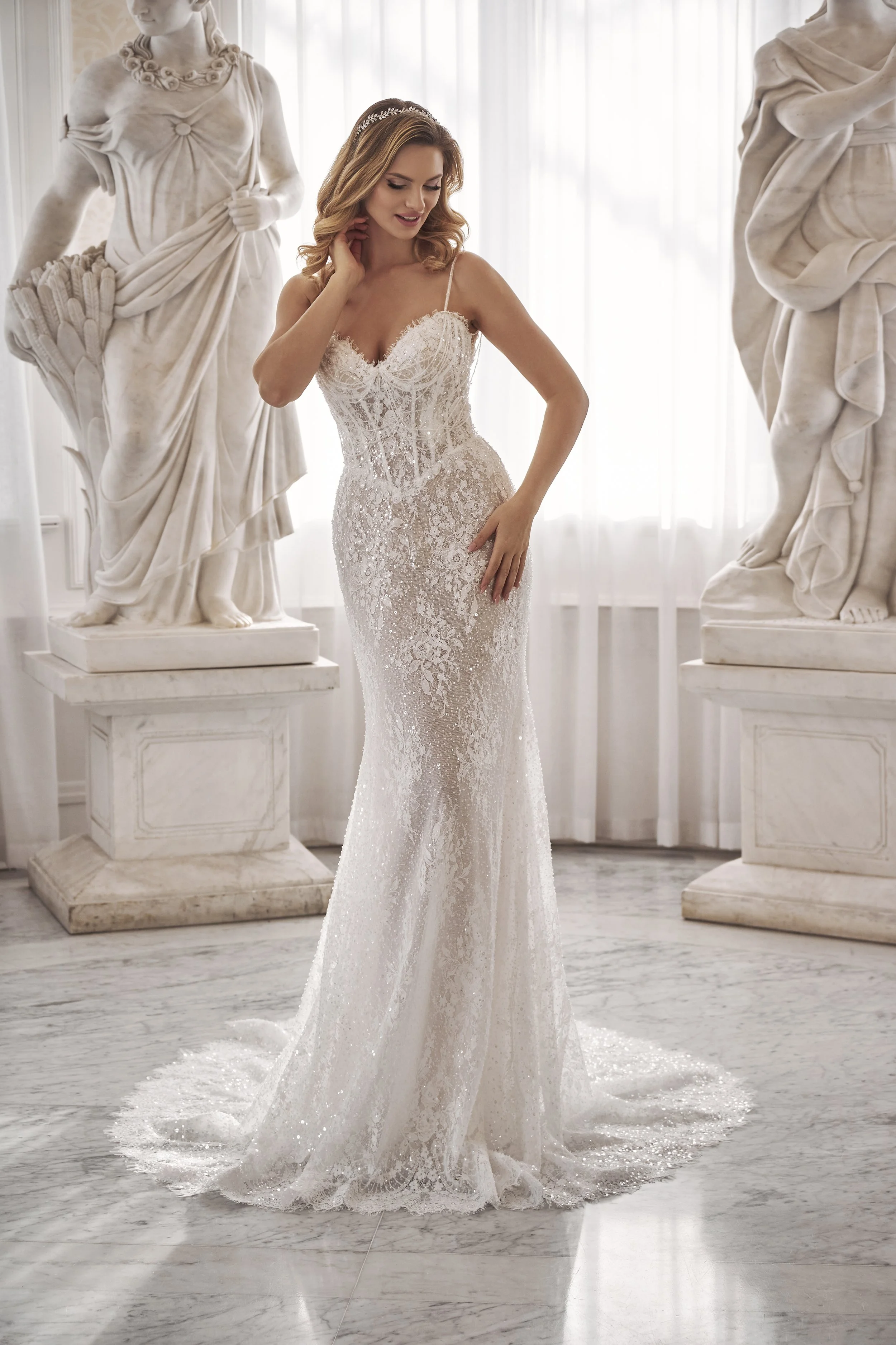 Full front view of Lia Bella Model Tamra, a sparkling fit-and-flare wedding dress with a structured corset bodice.