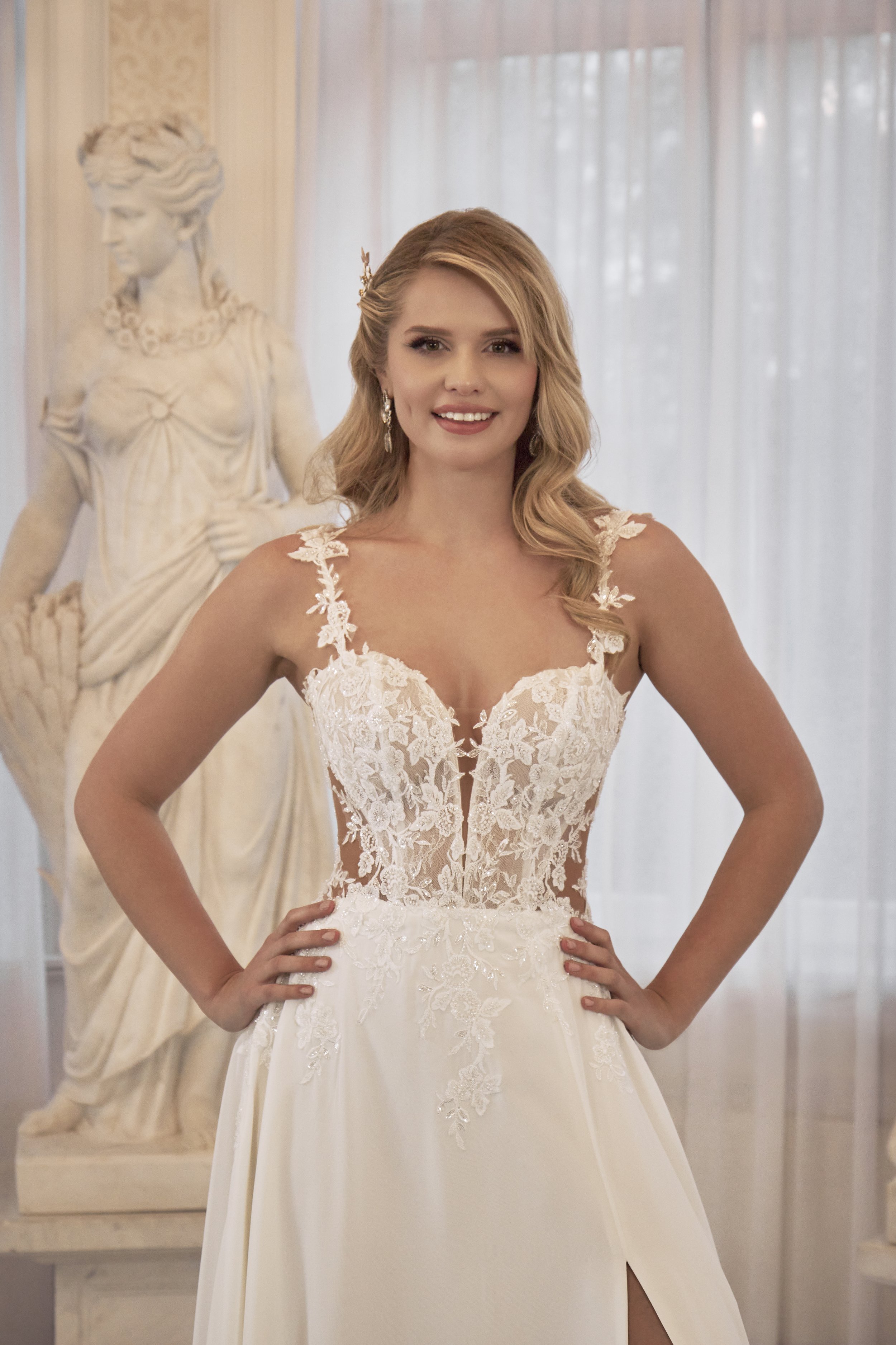 Close-up of Lia Bella Model Tiny featuring a floral lace illusion corset, plunging sweetheart neckline and delicate lace straps.