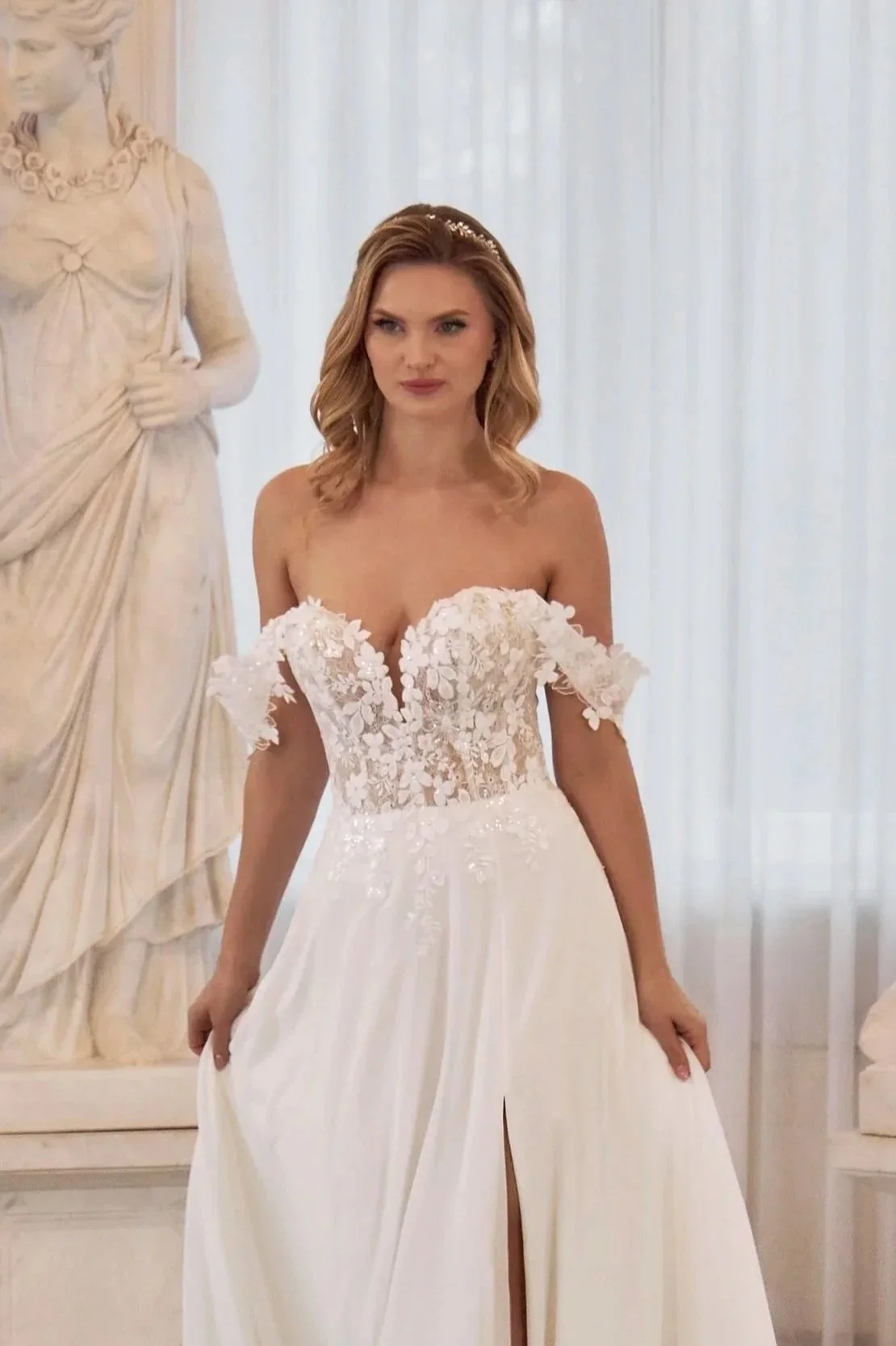 Front view of Lia Bella Model Theodora showing the high skirt slit, sweetheart neckline and off-the-shoulder lace straps.