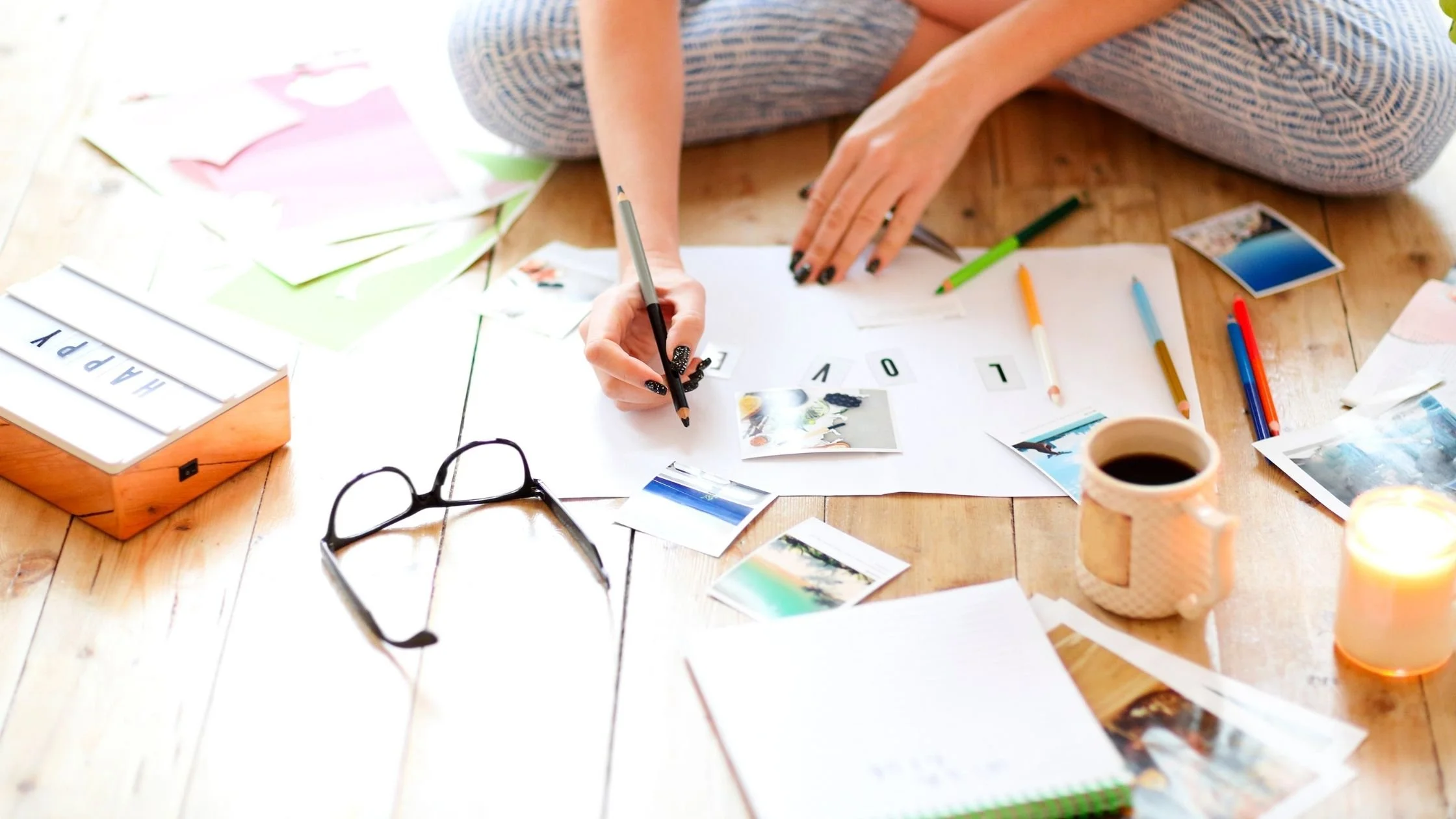 A person creating a vision board for their business and life