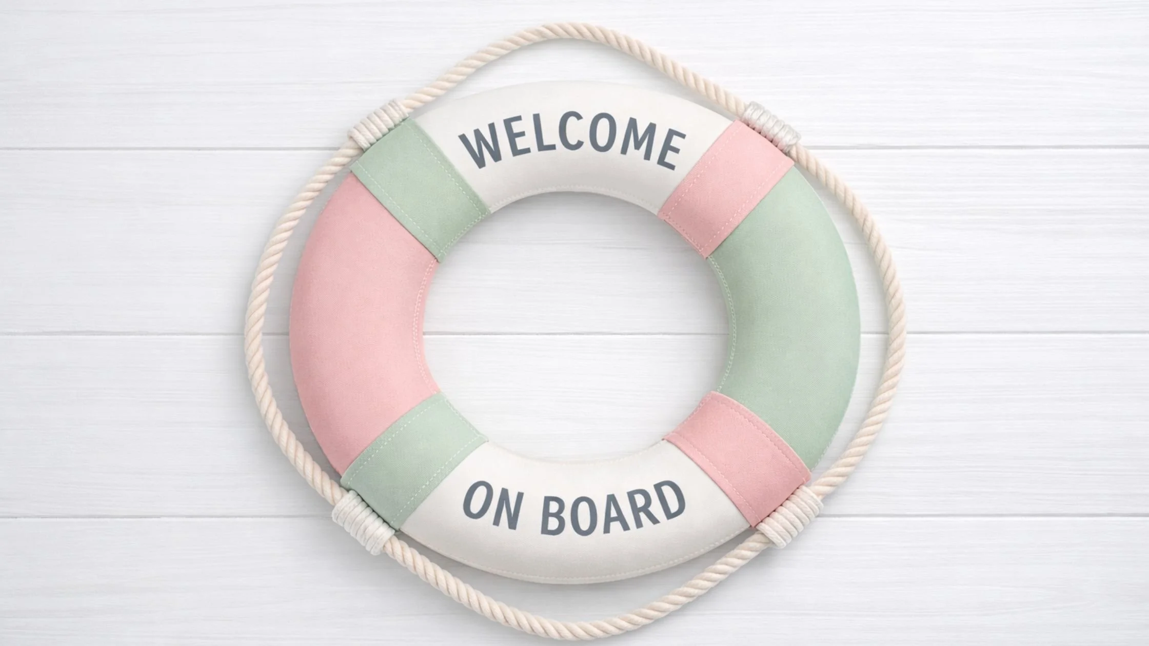 Minimalist lifebuoy saying  'Welcome On Board'  and rope detail on a white background, representing client onboarding.