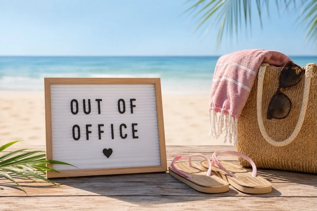Out of office sign on a sunny beach with flip-flops and a beach bag, illustrating a small business owner taking a well-earned holiday