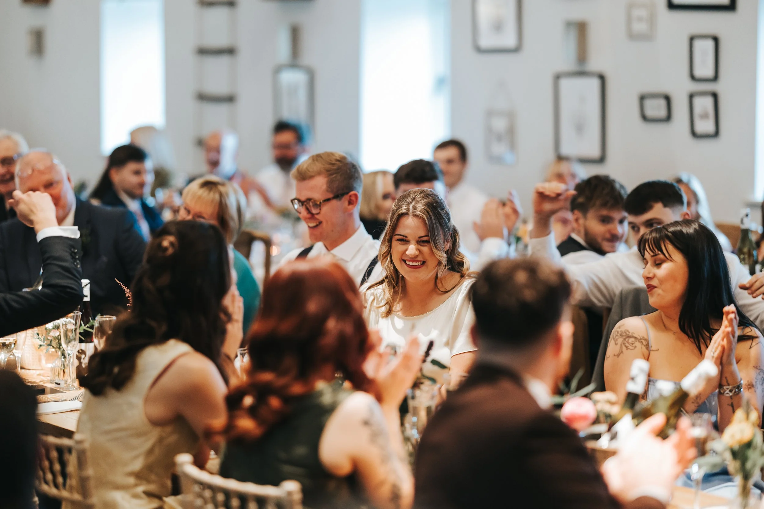 People at a wedding reception laughing and enjoying themselves