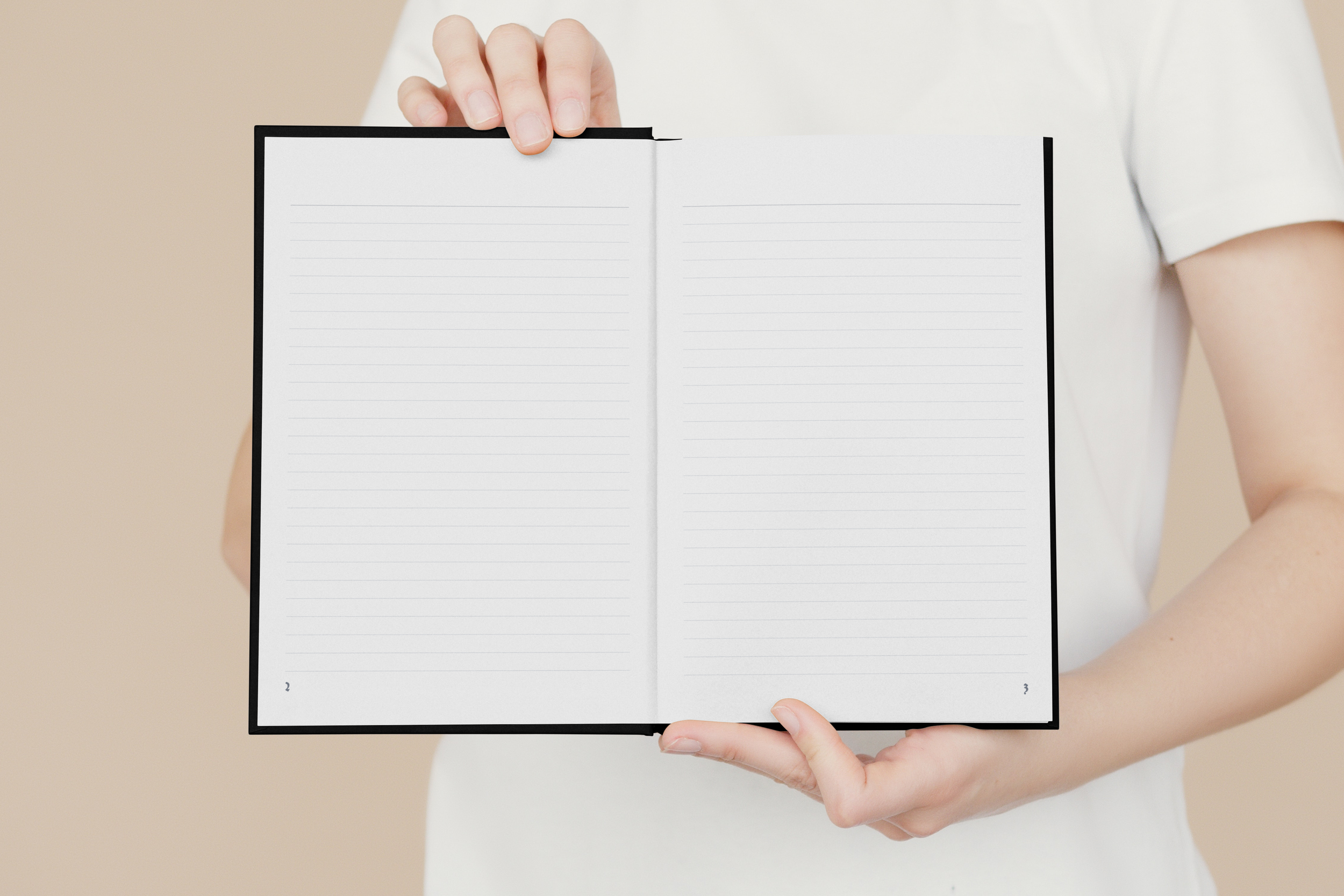 Open Book in Hands Mockup.png