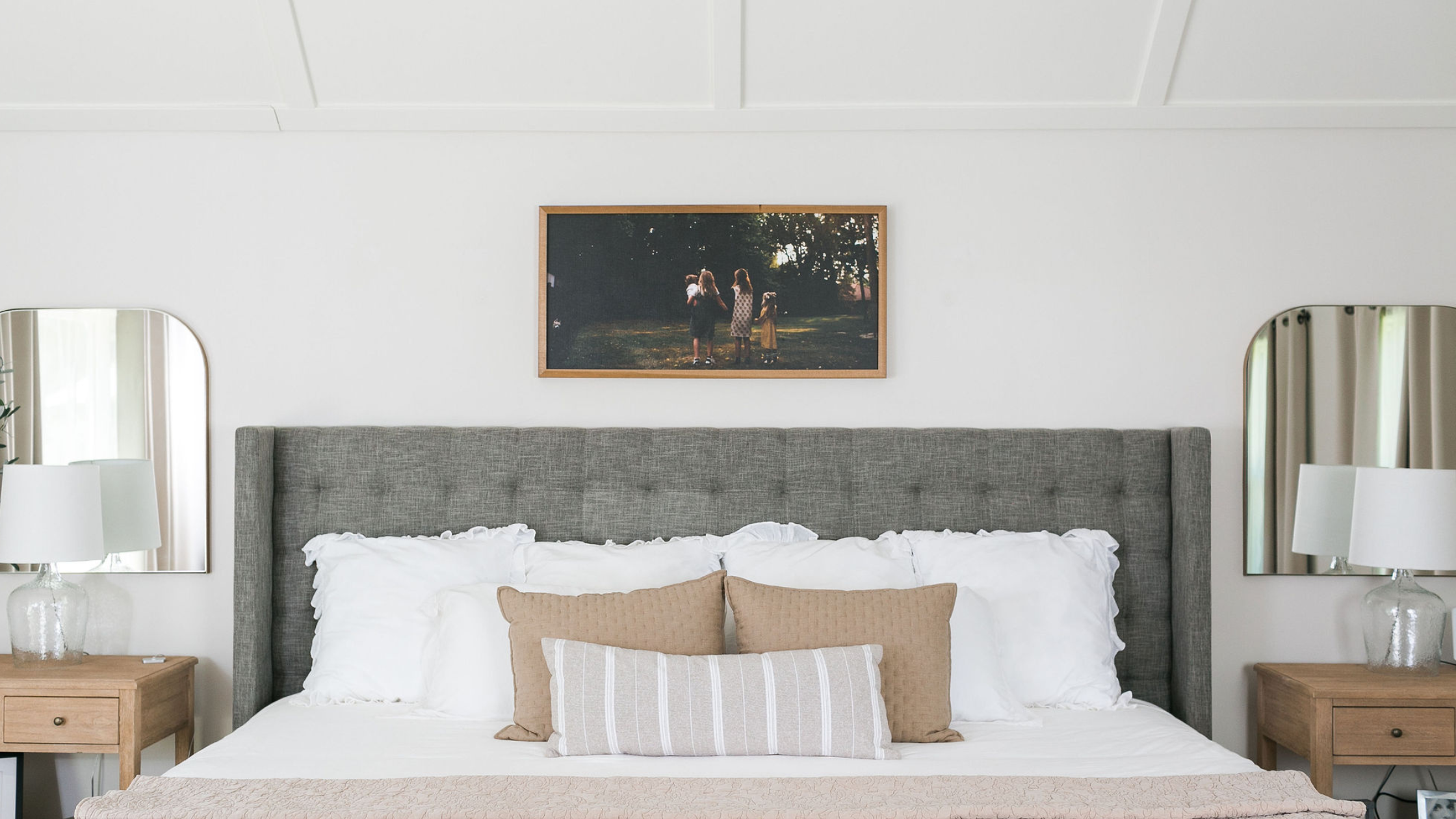 Cozy, lived-in Central Maine living room with neutral colors, soft textures, warm lighting, and simple, clean staging details.