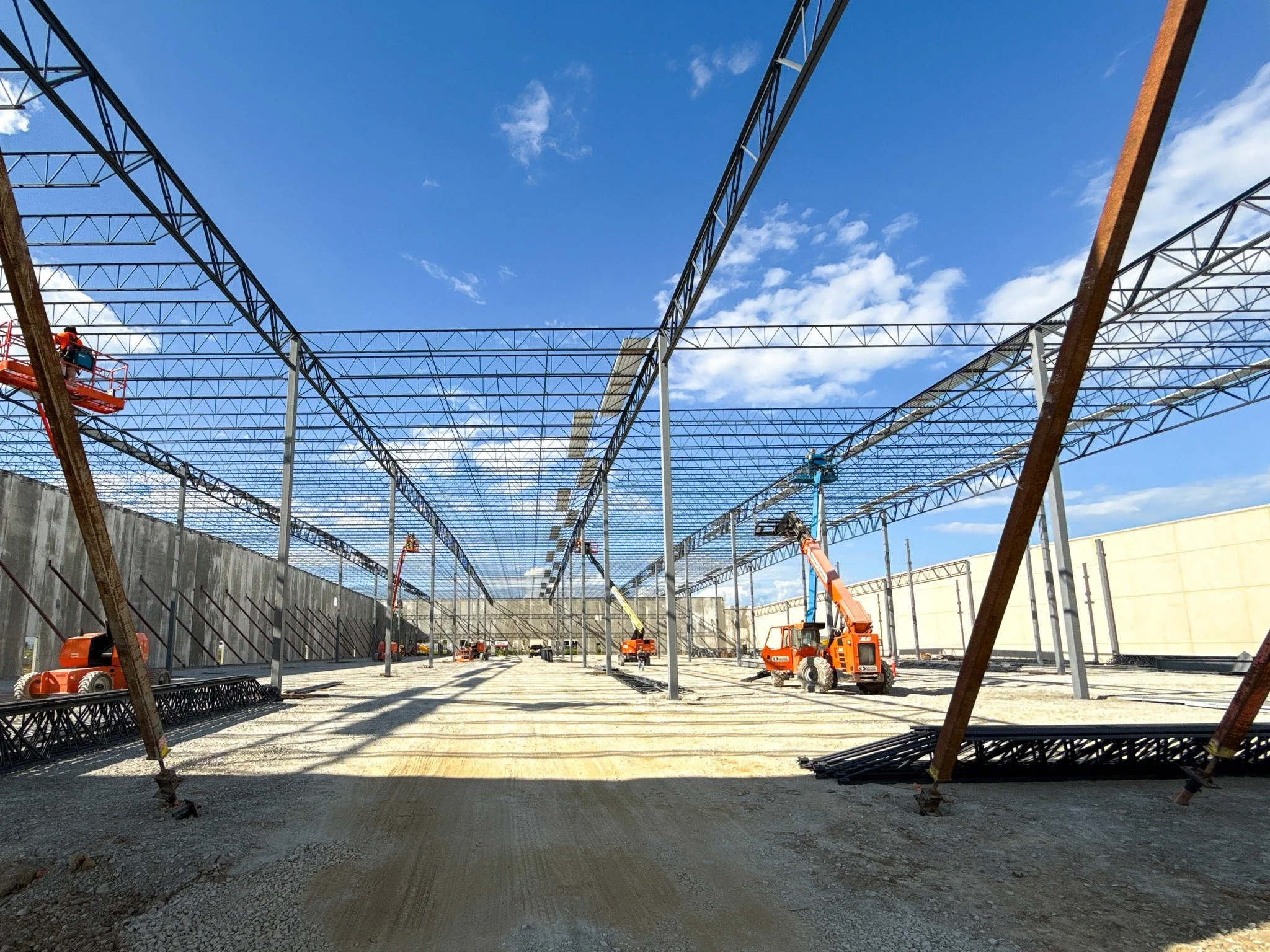 There's a lot happening at the Restaurant Equippers Inc expansion in Lockbourne, OH! New ponds have been excavated, water &amp; storm utilities are installed, 233 precast panels were erected in just 7 days, and the structural steel &amp; decking inst