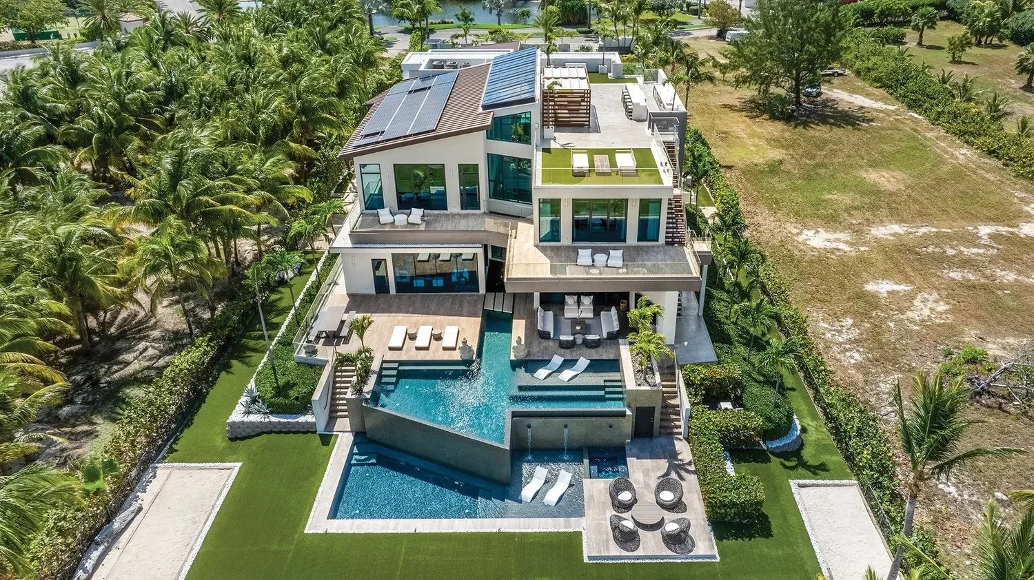 Aerial drone view of a modern home and roof in Grand Cayman