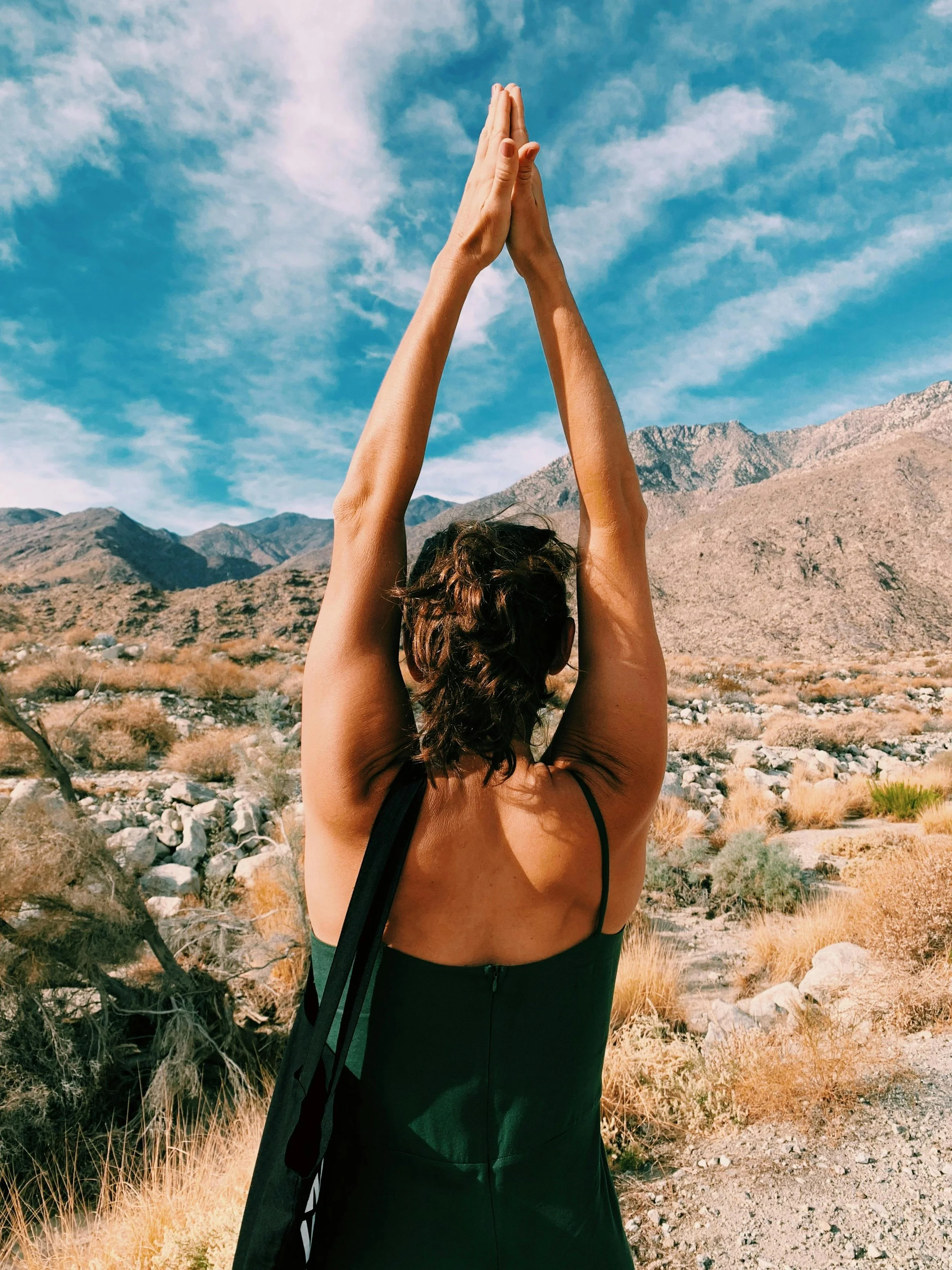 Woman doing Yoga in the mountains