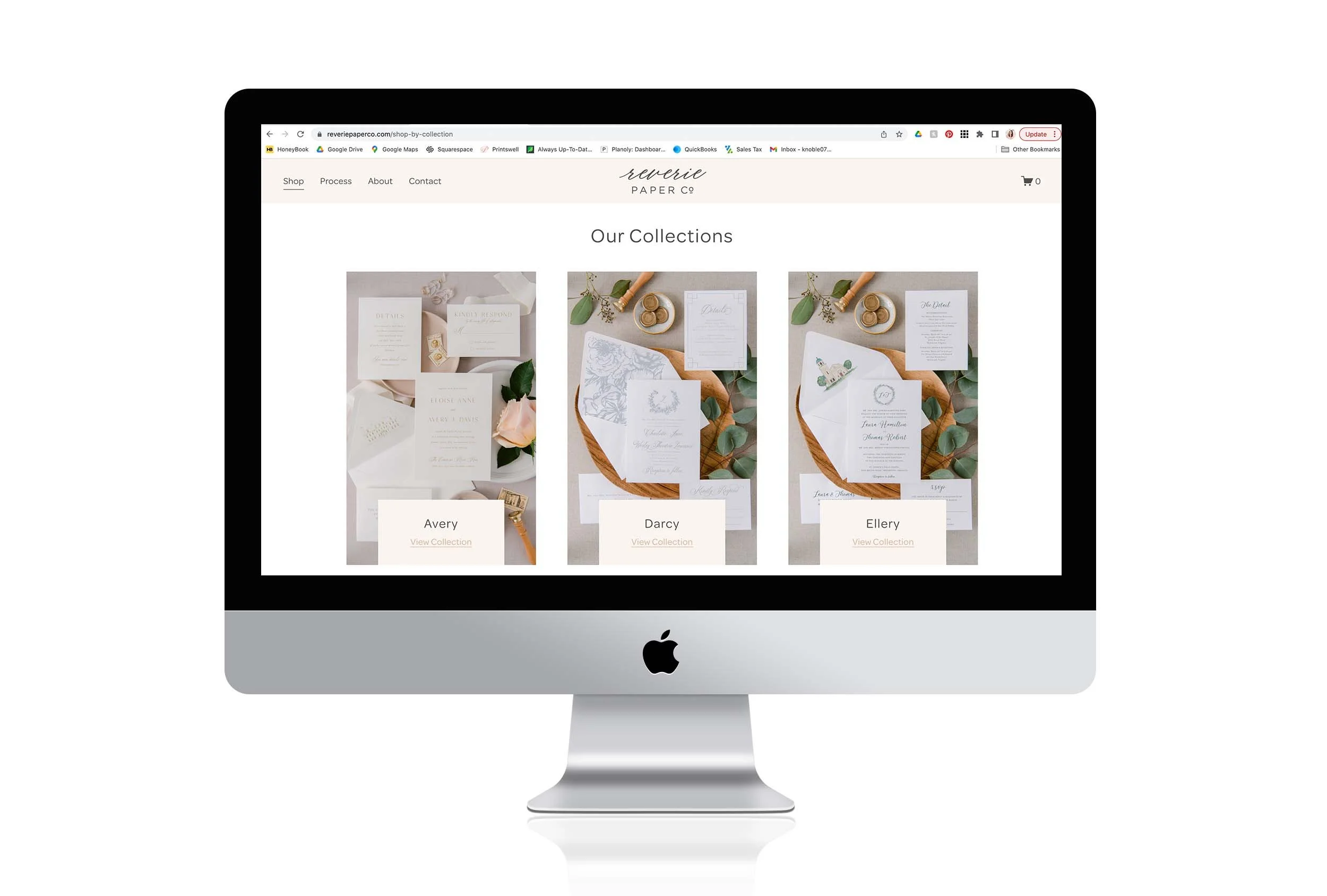 Computer monitor displaying a website with wedding invitation collections labeled Avery, Darcy, and Ellery.