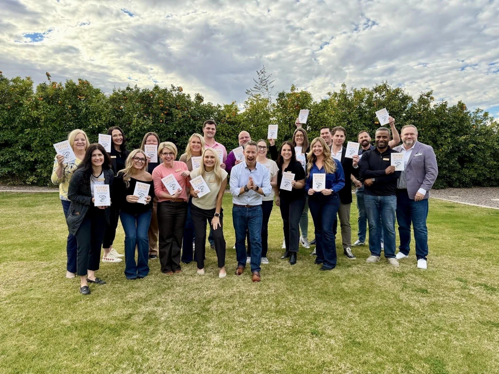 Participants in a RevenueGetter coaching intensive with their RevenueGetter books