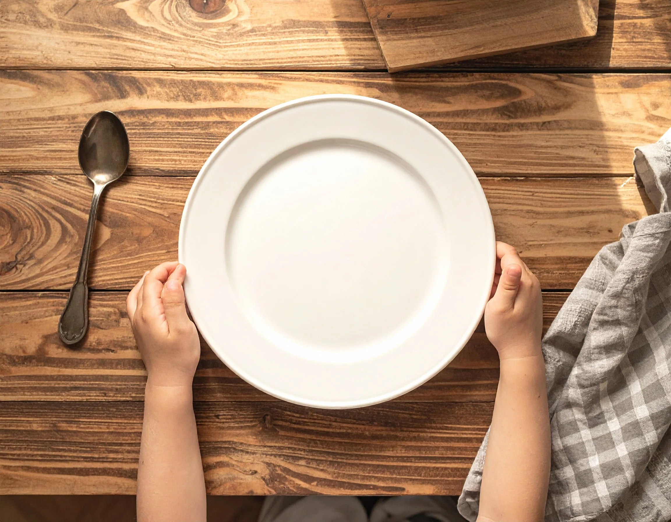 image of a white plate on a table