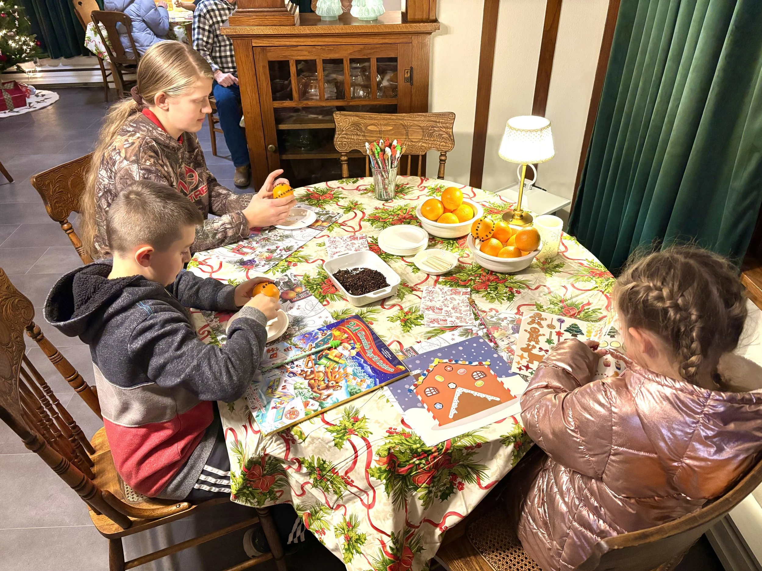 Making pomander balls and having fun with stickers at Winter Wonderland 2025.