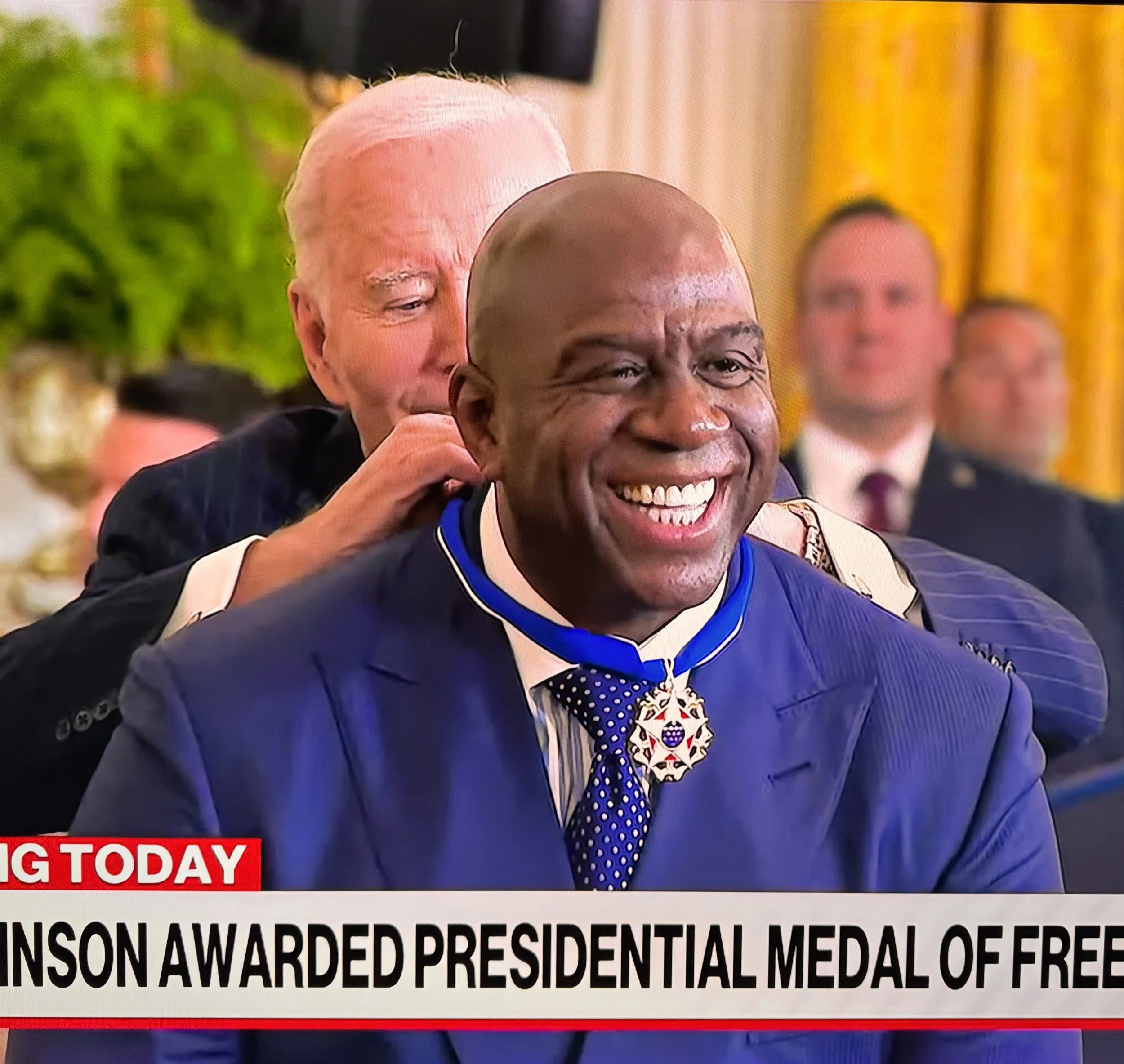 Earvin "Magic" Johnson receives the Presidential Medal of Freedom from President Joe Biden.
