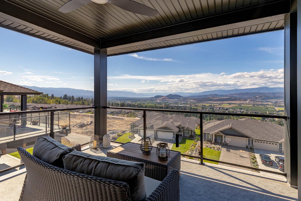 view of the okanagan valley from a patio at sunset ranch