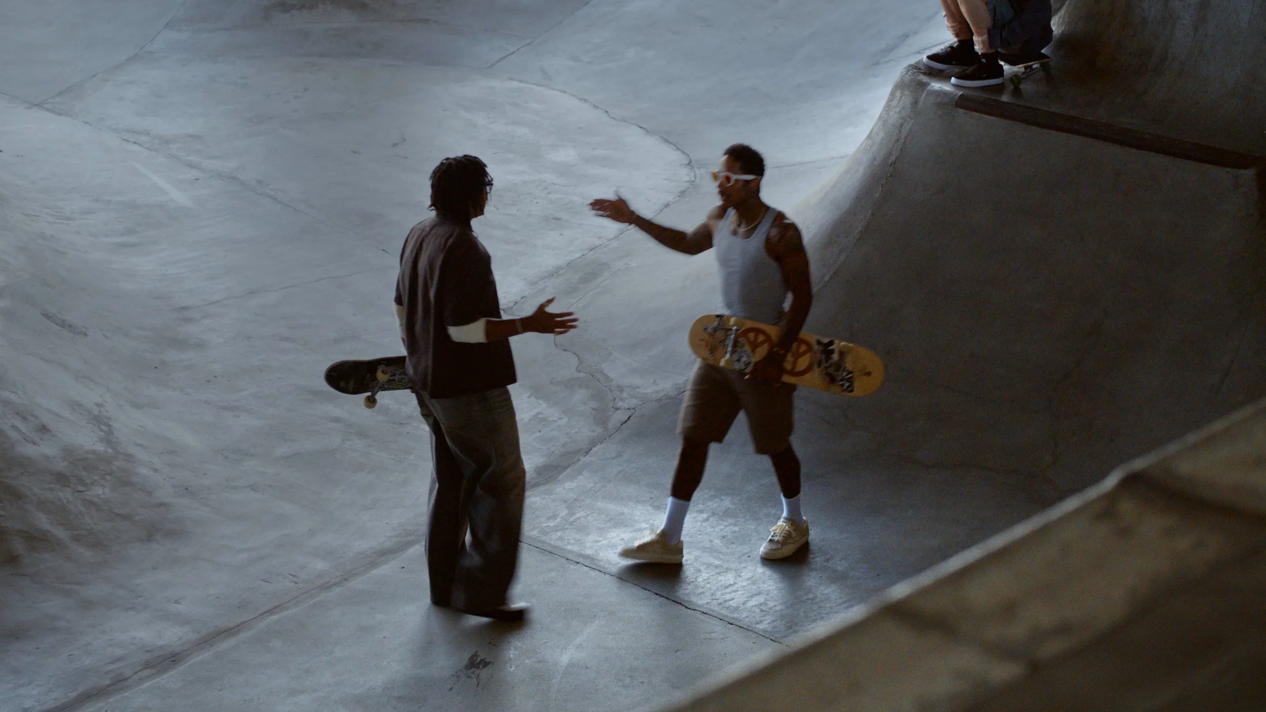 two skateboarders wearing meta oakley glasses
