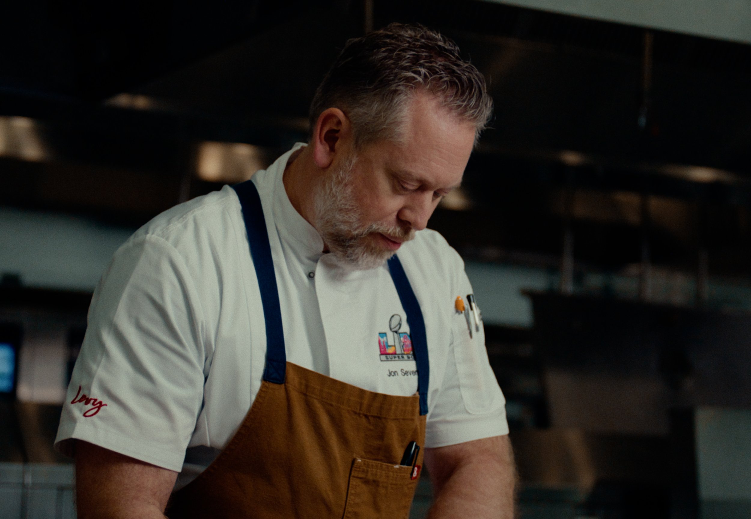 chef of levy foods creating the dishes for super bowl LX in the kitchen.