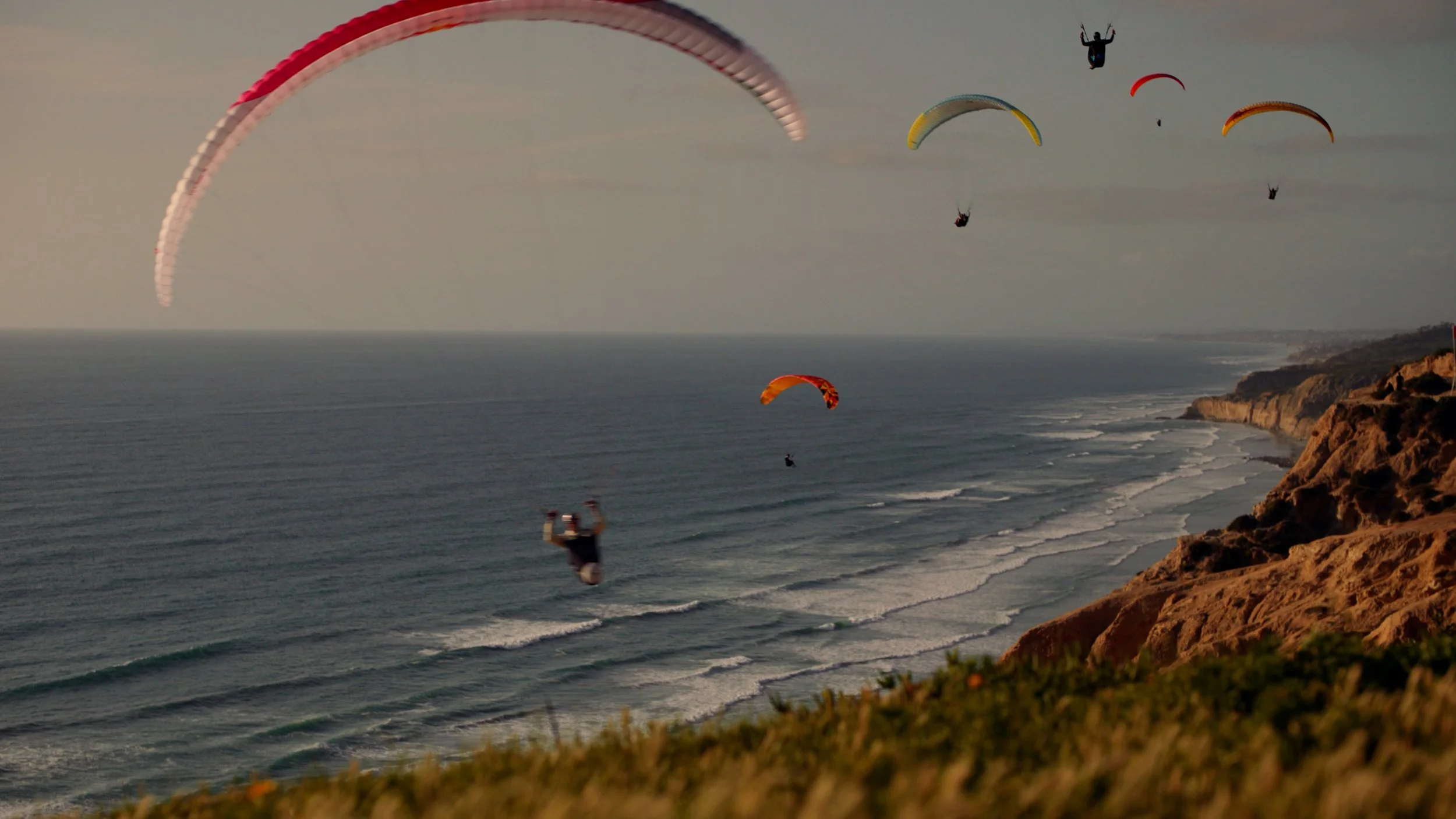redbull paraglider bicho carrera in la jolla cliffs wearing meta oakley AI glasses