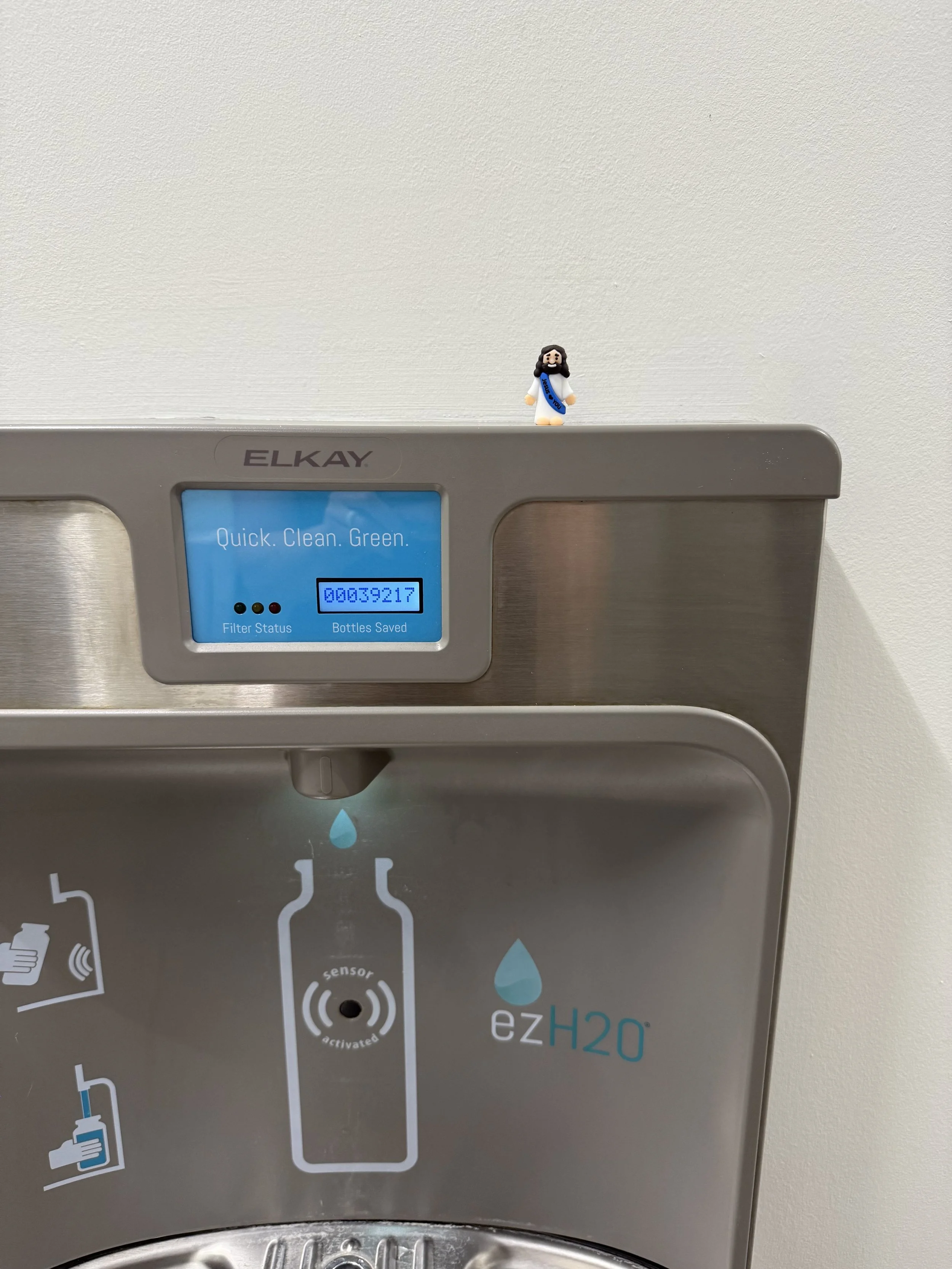 Mini Jesus on a water fountain.jpeg