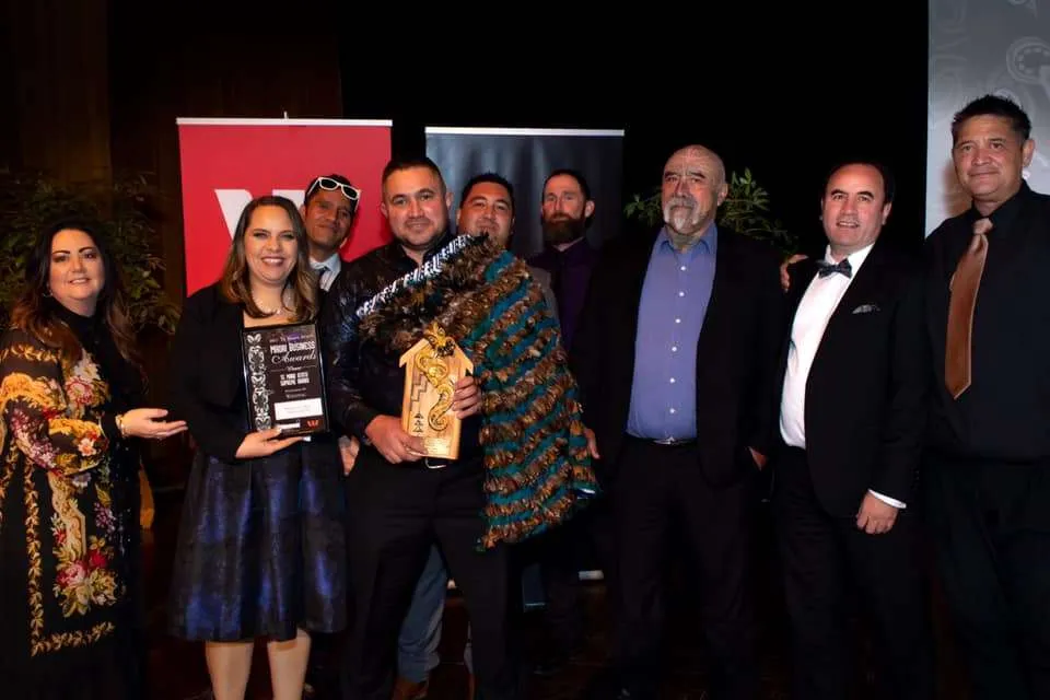 Rivercity Tree Service team members collecting an award at the Te Manu Atatu awards.