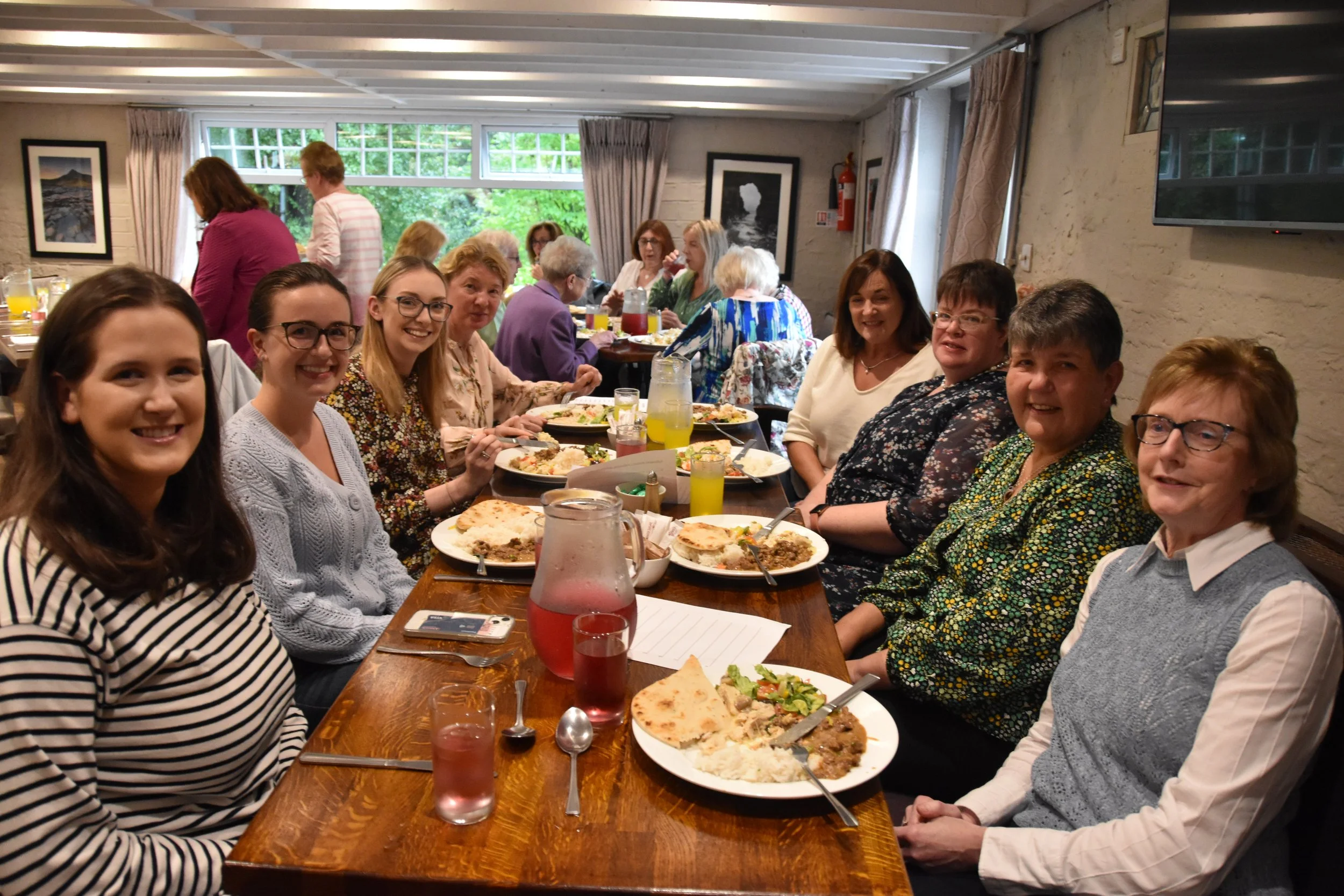 Church members chatting over a meal together