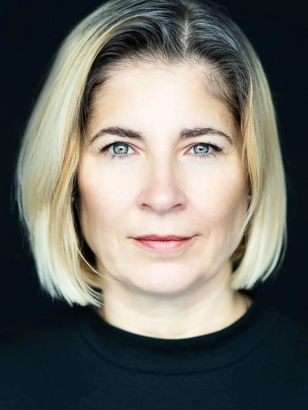 Professional headshot of a blonde businesswoman by Vera Gošić Photography