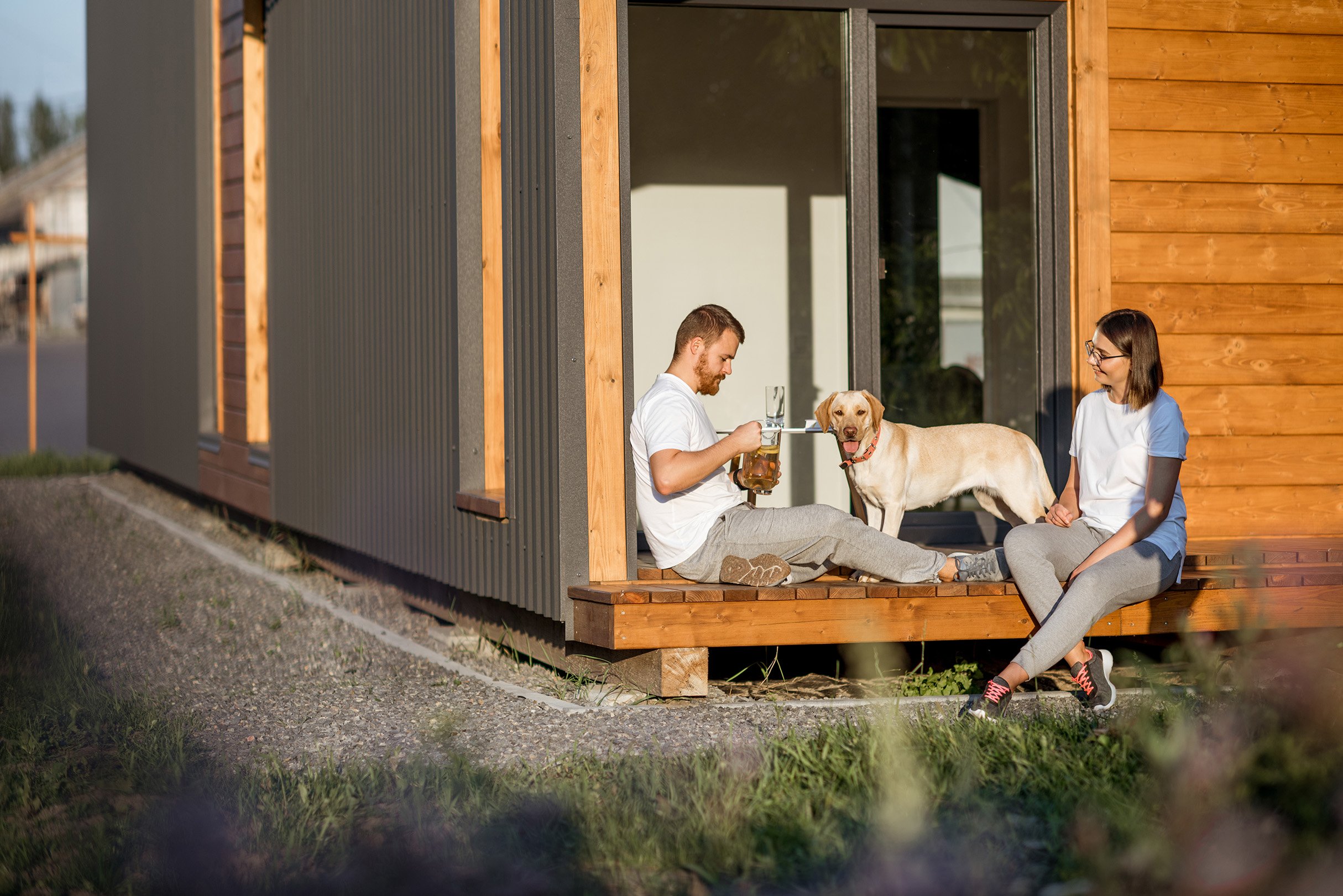couple-with-dog-on-the-backyard-of-their-house-2023-11-27-05-27-50-utc-WEB.jpg