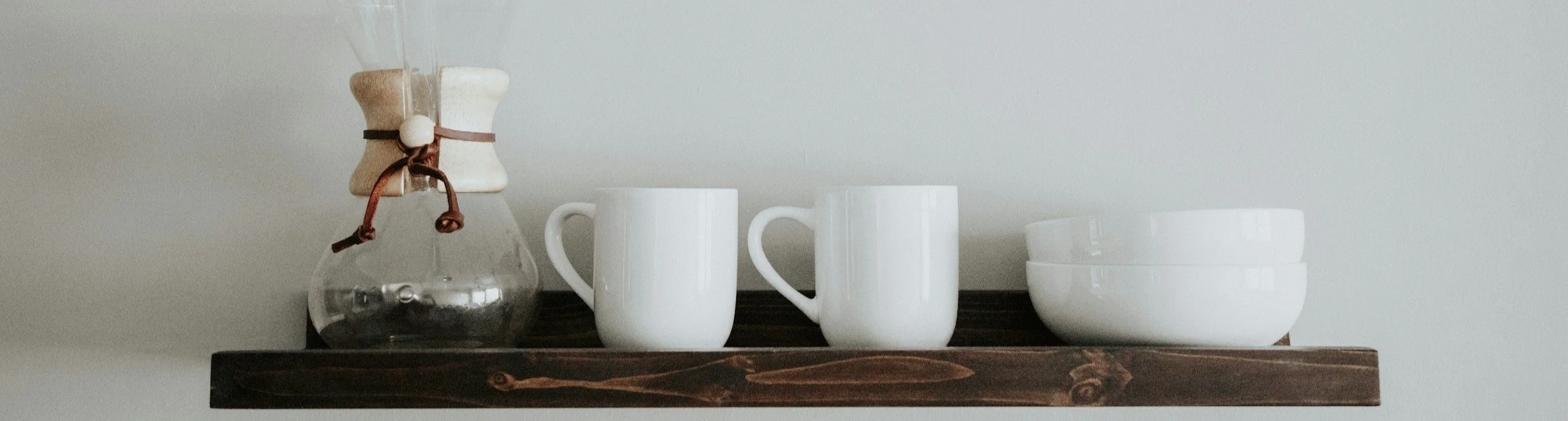 Minimal open kitchen shelving with organized mugs in a Princeton, New Jersey home