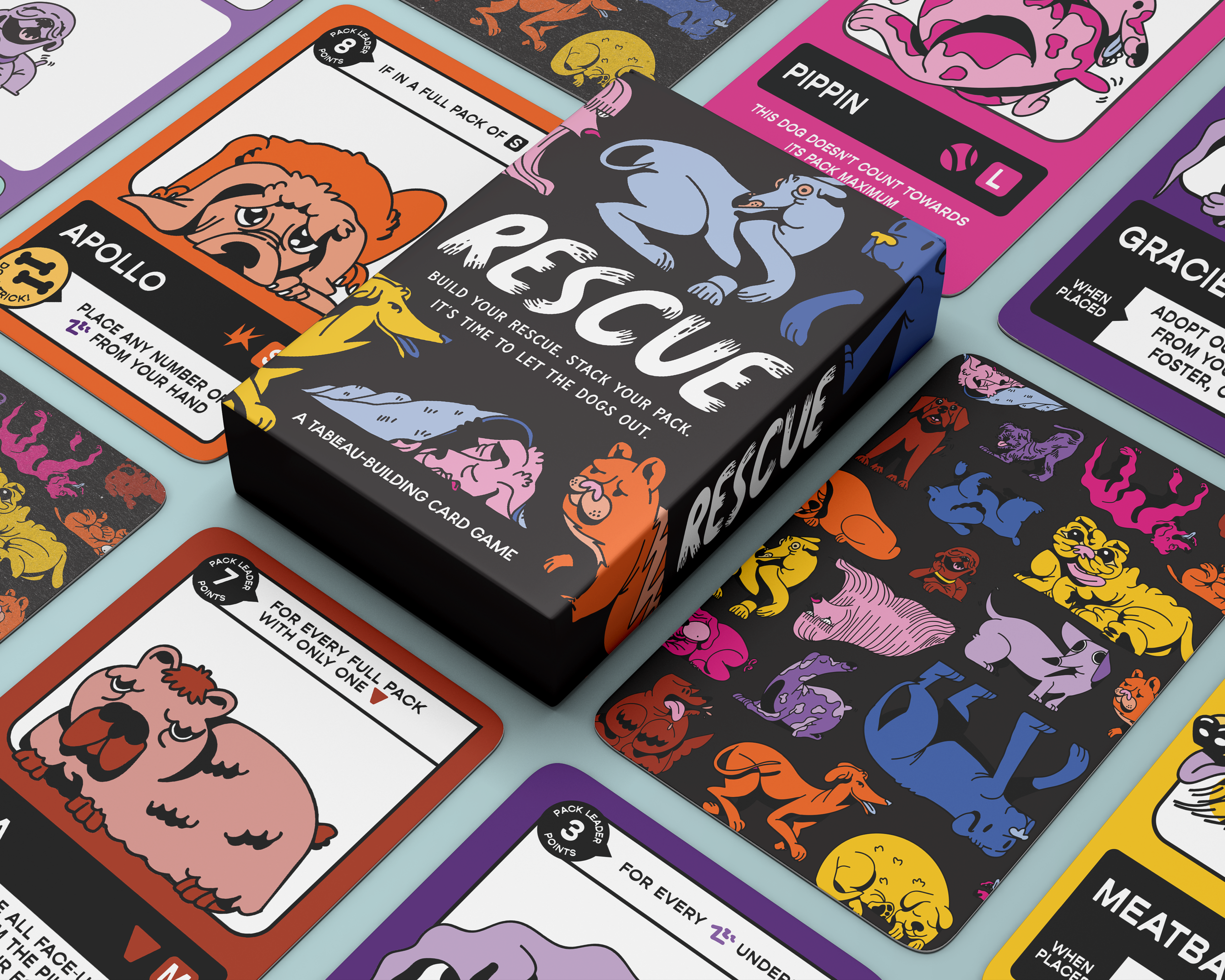 Rescue, a tabletop-building card game with dog rescue themes, featuring colorful illustrated dog characters on its box and cards.