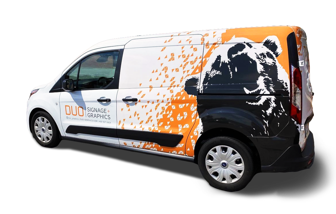 White commercial van with an orange and black bear graphic on the side and the text 'DUO Signage + Graphics'.