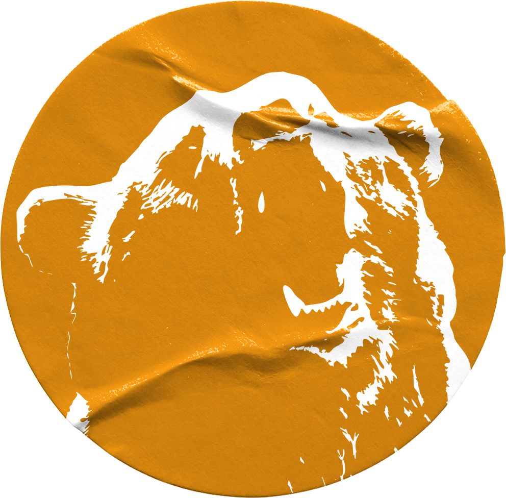 Orange circular sticker with a white stencil-style illustration of a roaring lion's face.