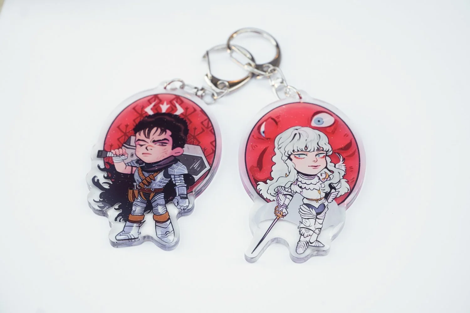 BERSERK: GUTS & GRIFFITH KEYCHAINS — KOHI & ANDIE