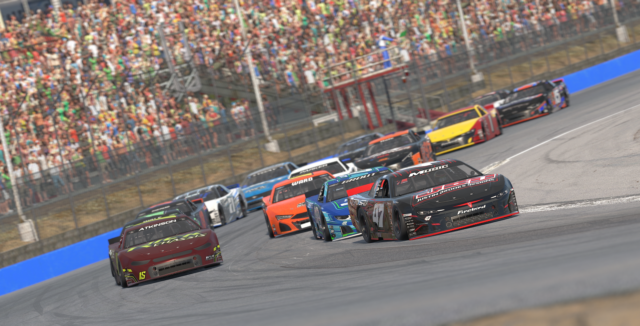 Multiple race cars navigating a sharp turn on a race track, with a packed crowd of spectators in the background.