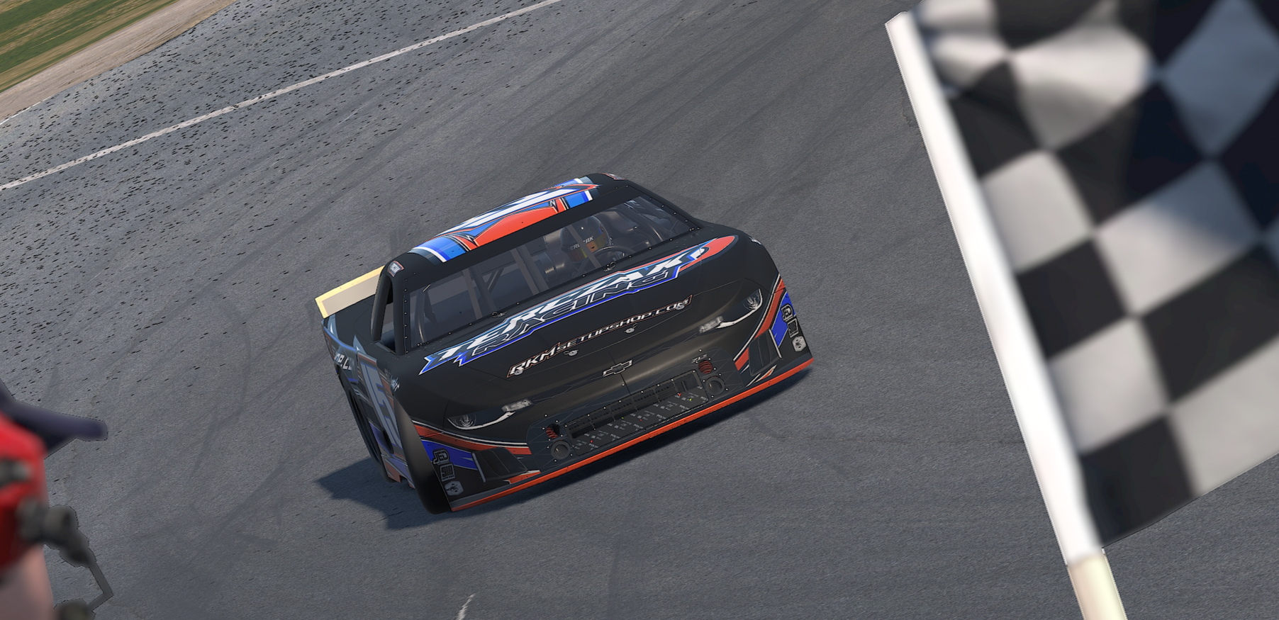 A race car crossing the finish line on a track