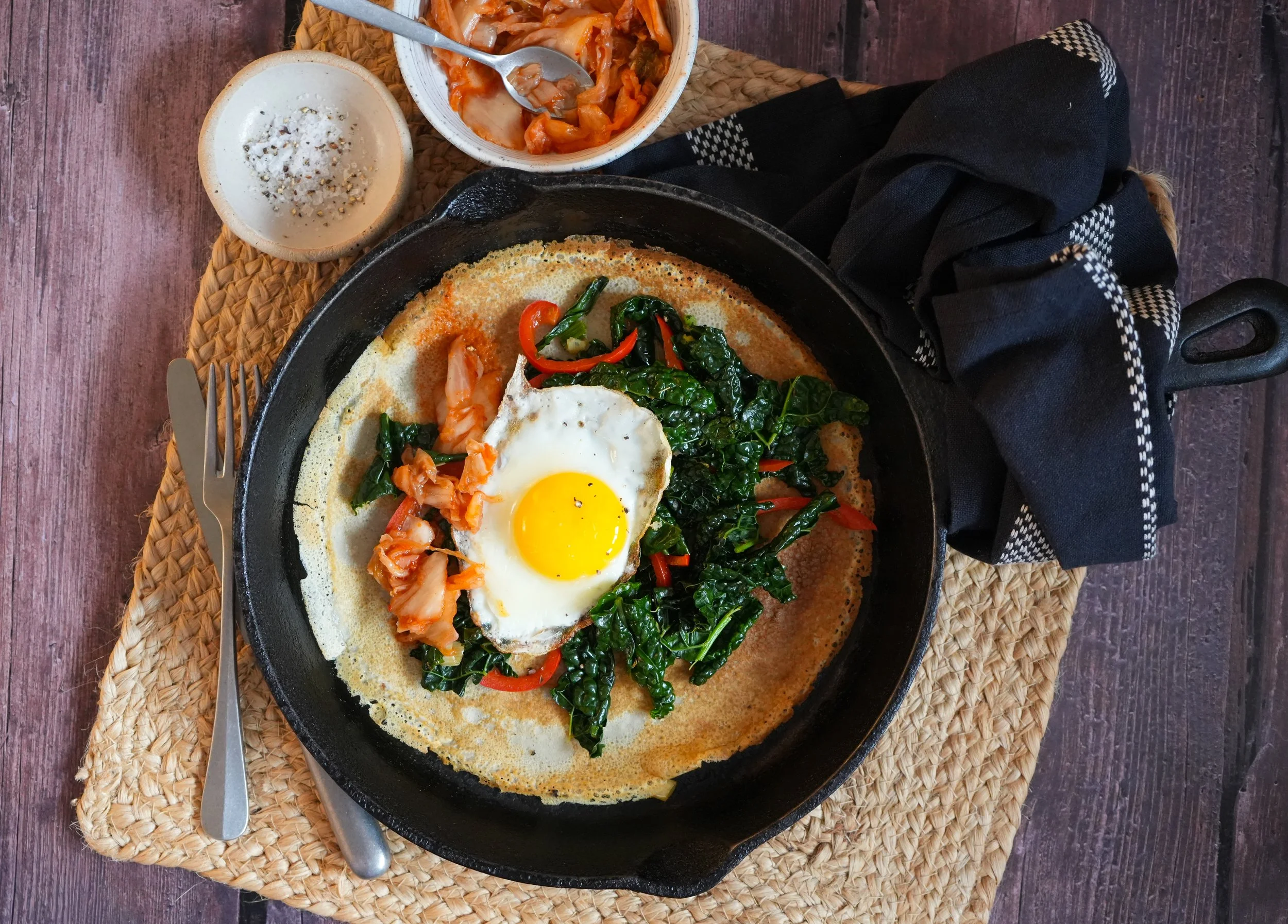 Buckwheat pancakes with kale, kimchi and egg