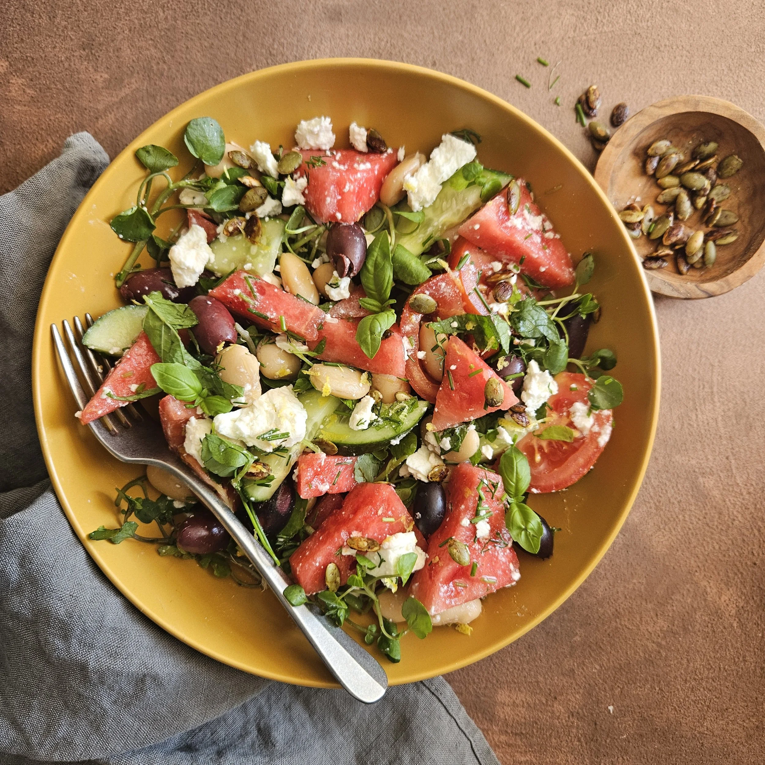 Watermelon, feta and butterbean salad with tamari toasted pumpkin seeds