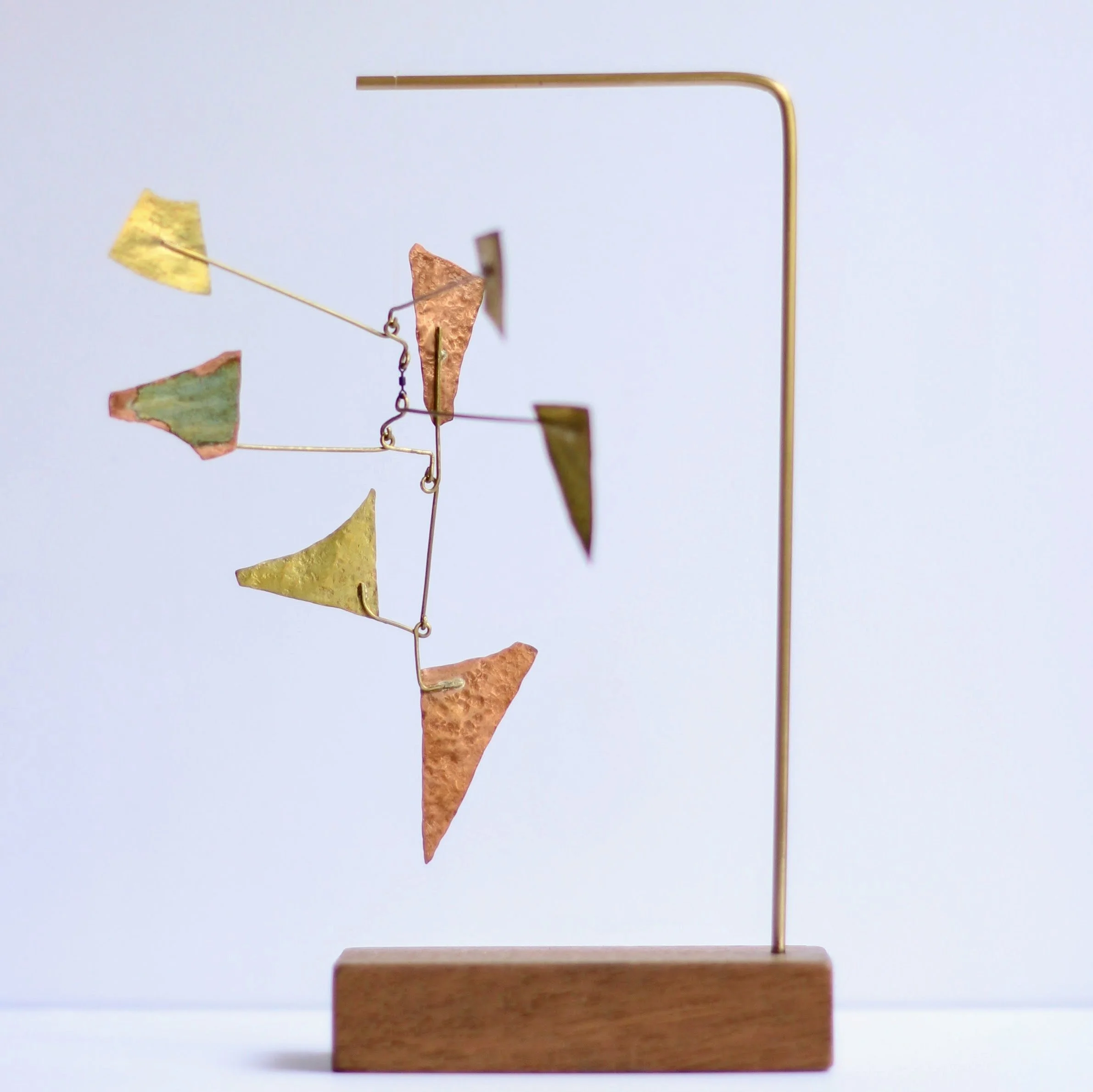 Strange Receiver #4 brass, copper, fishing swivel, vintage wooden toy building block, collaged with vintage postcard of seaside golf course.