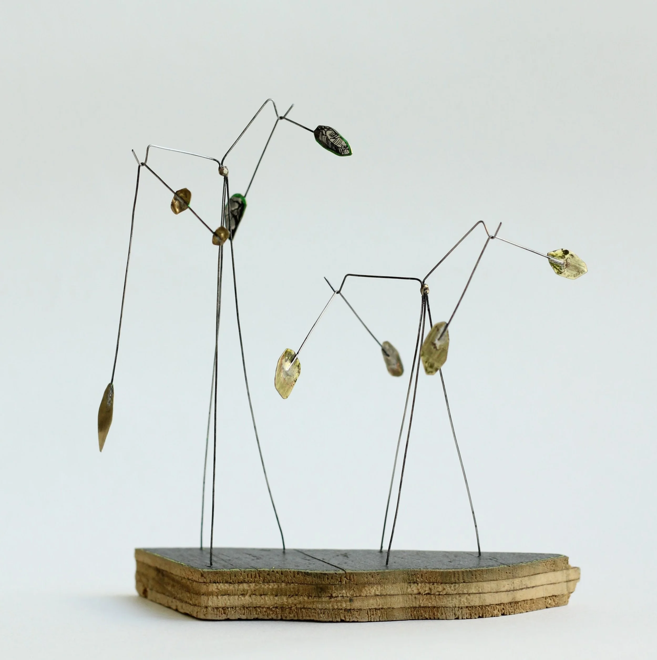 Strange Receiver #10 brass and steel, driftwood block from Southend beach, collaged with tiny ancient stones from a vintage atlas of ancient archaeology.