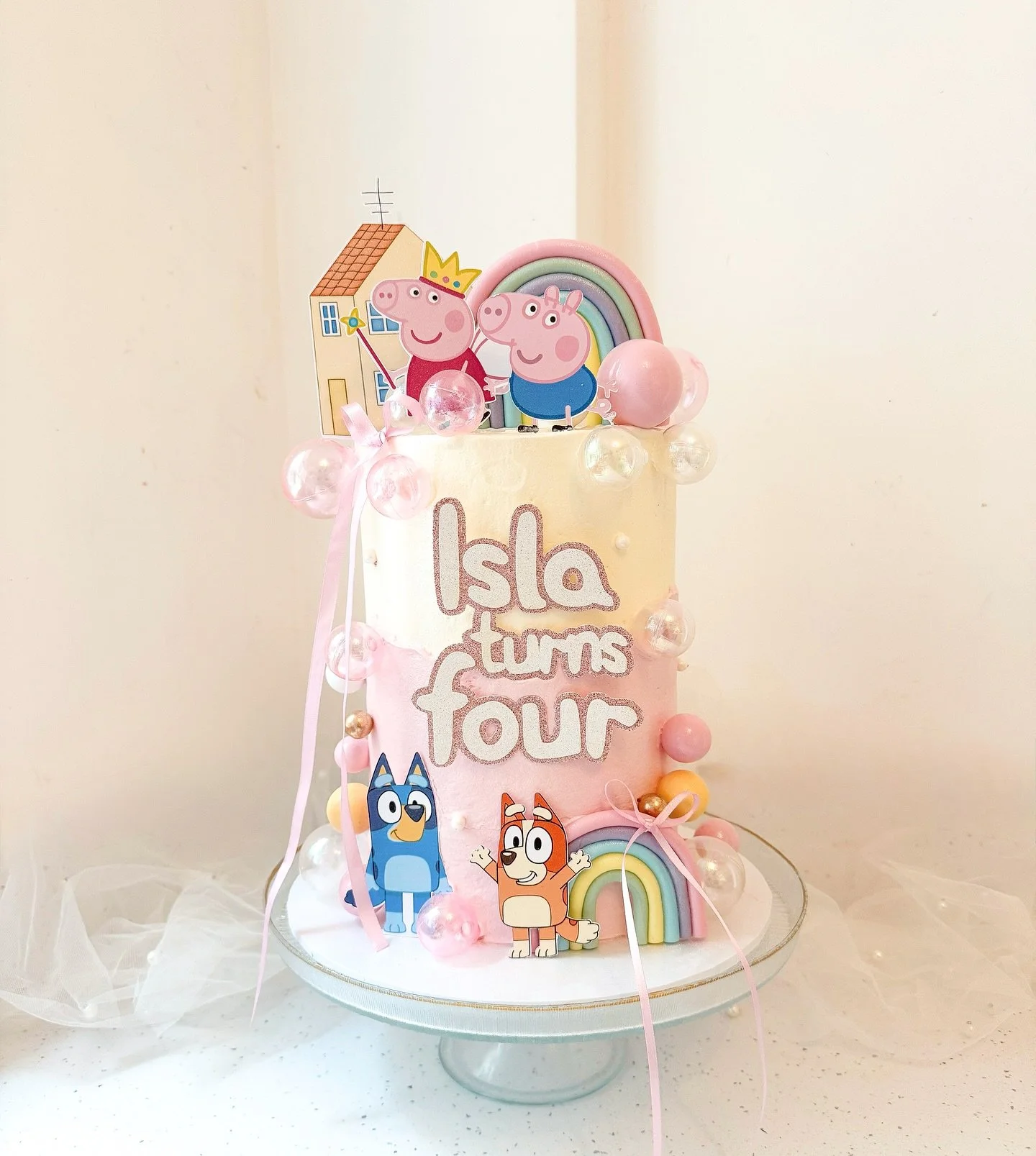 Our Isla turns four 🩷

Bluey and Peppa with rainbows, bubbles and glitter. 

Happy birthday to our &lsquo;everything must be pink&rsquo; perfect girl 🩷 

🩷 6&rdquo; tall lemon and raspberry 
🩷 card toppers @burntisland_occasions 
🩷 all other sup