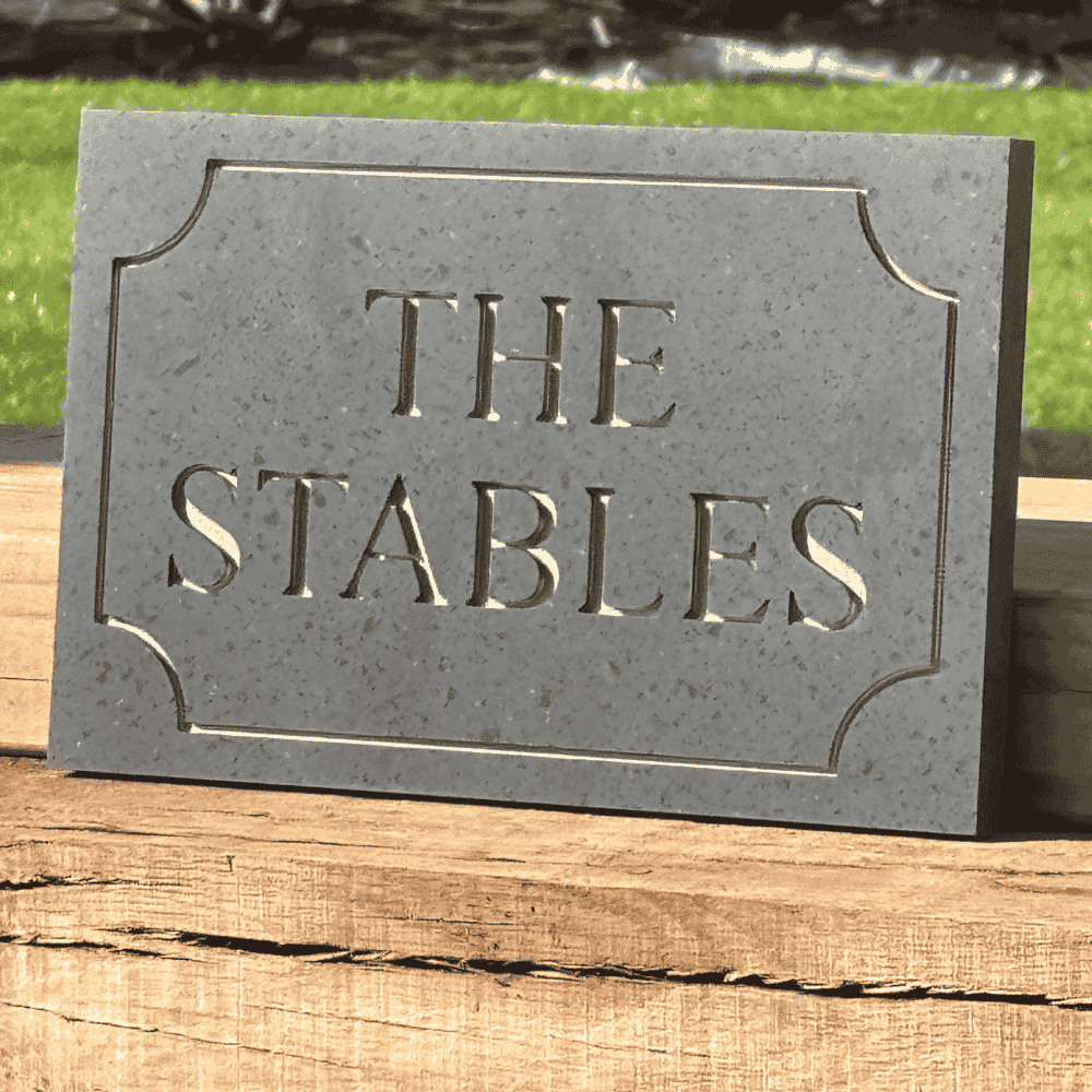 Charcoal house number plaque with copper lettering and border