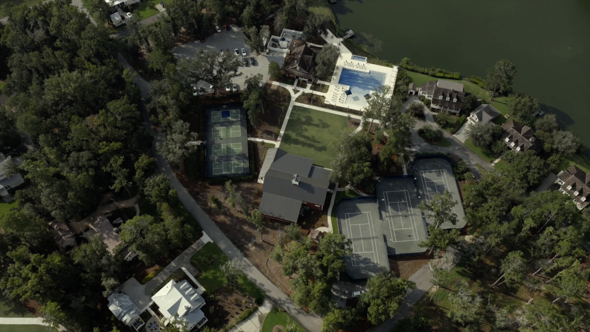 Aerial view of swimming pool and tennis courts