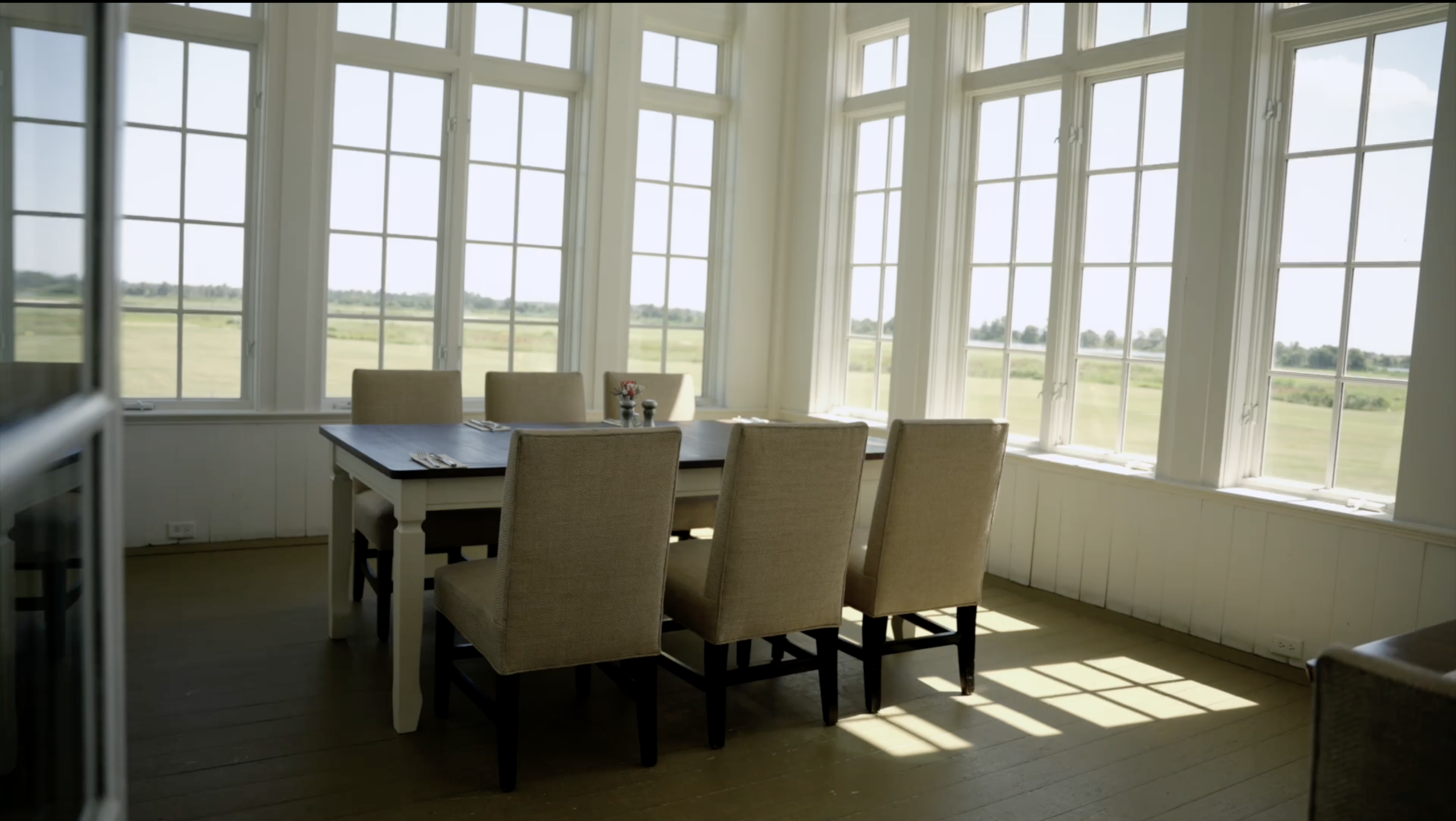Sunlit dining room overlooking the Lowcountry landscape