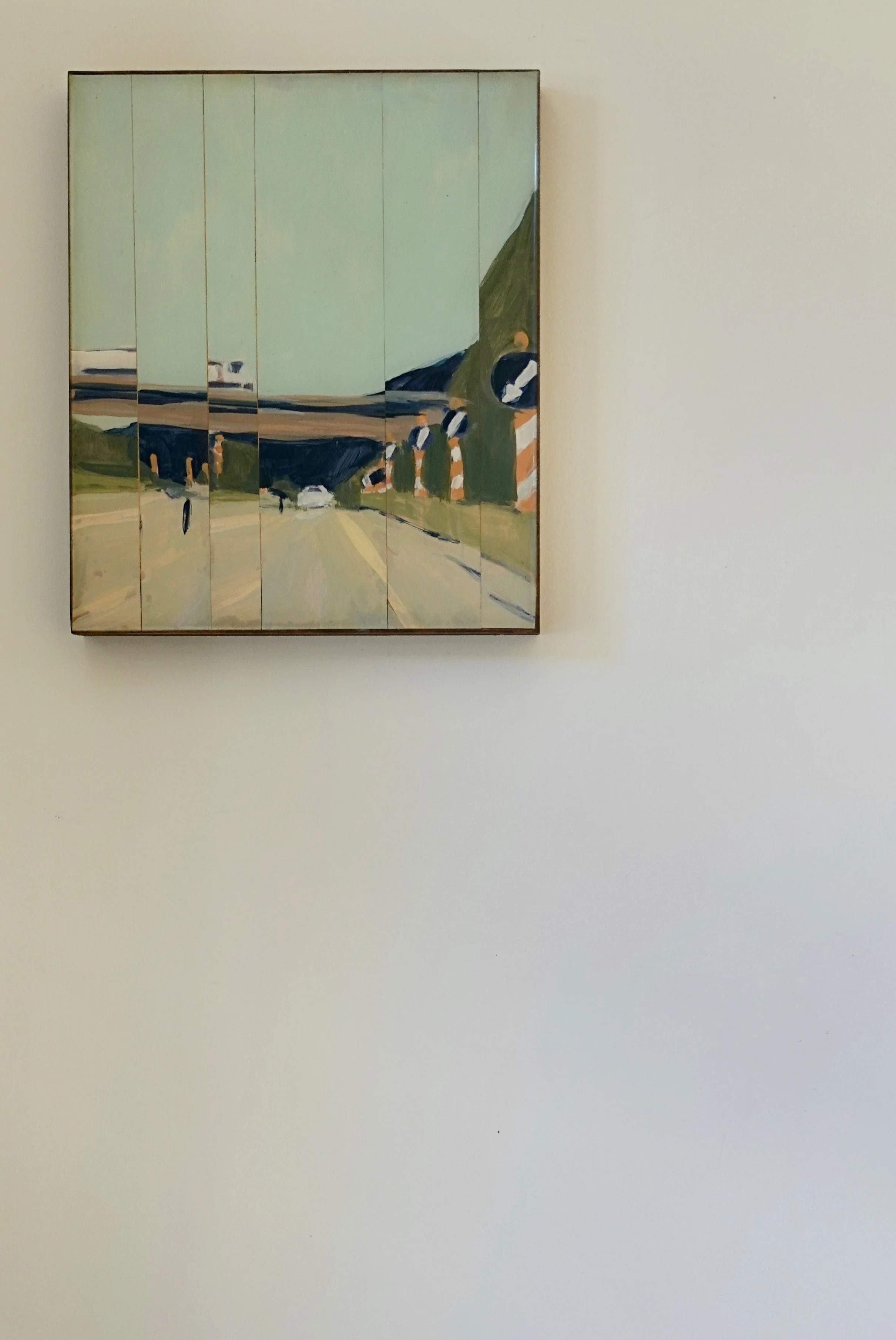 Collage of a painting of a road with a bridge, trees, cars, highway signs, and a mountain in the background.