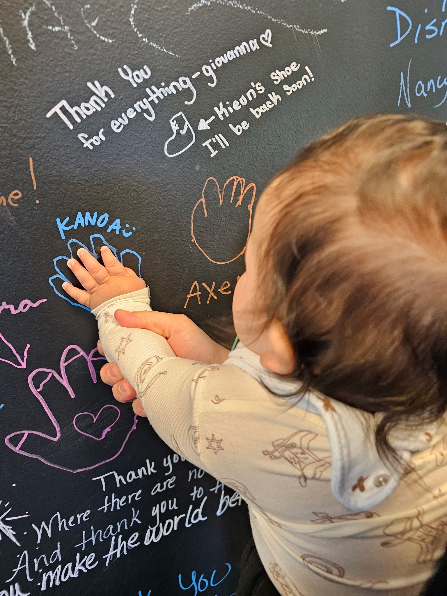 Kanoa visiting his old PT and got to see his graduation handprint :)